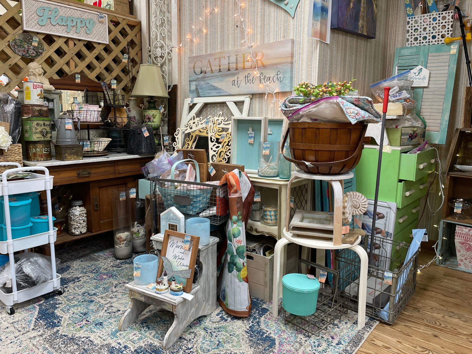 A cluttered antique shop interior with various items, including furniture, decor, and art in a variety of colors.