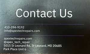A close up of a business card that says `` contact us ''