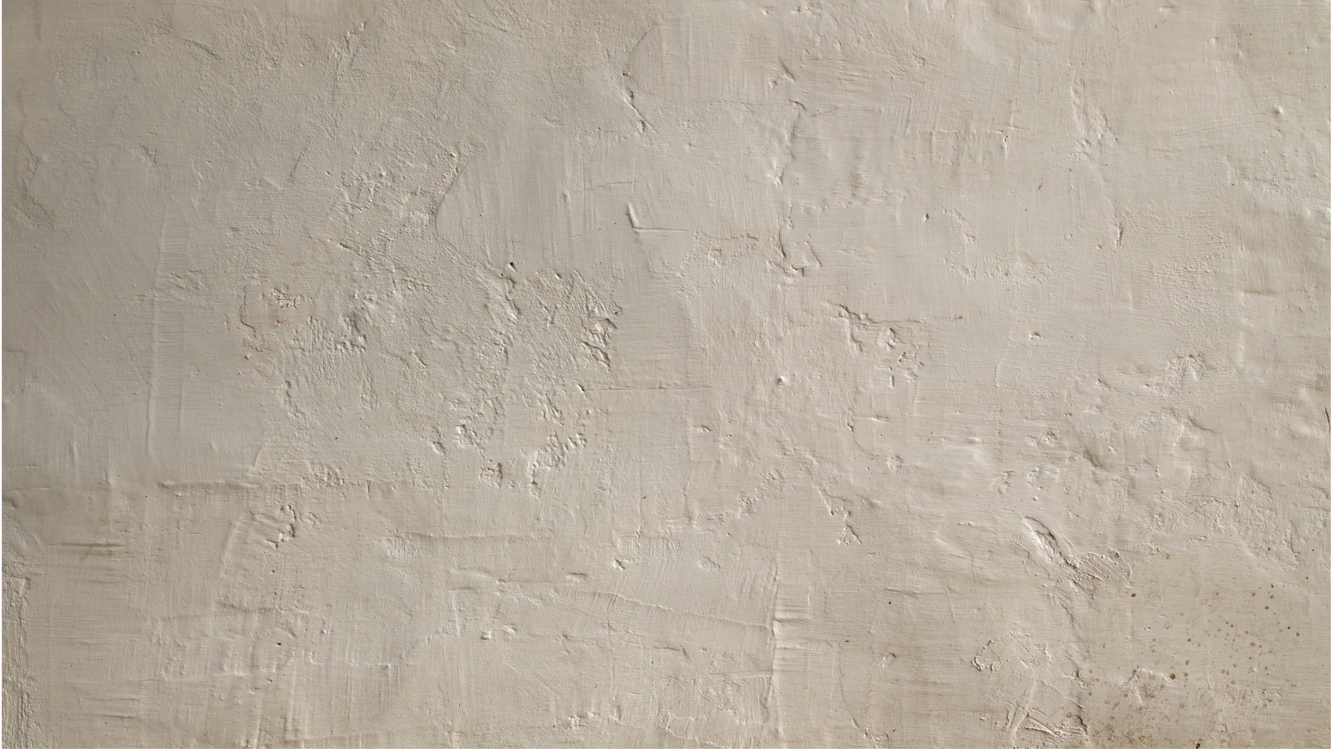 a close up of a white wall with a concrete texture .