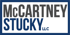 McCartney Stucky LLC logo in a blue box, with gray text on a white background.