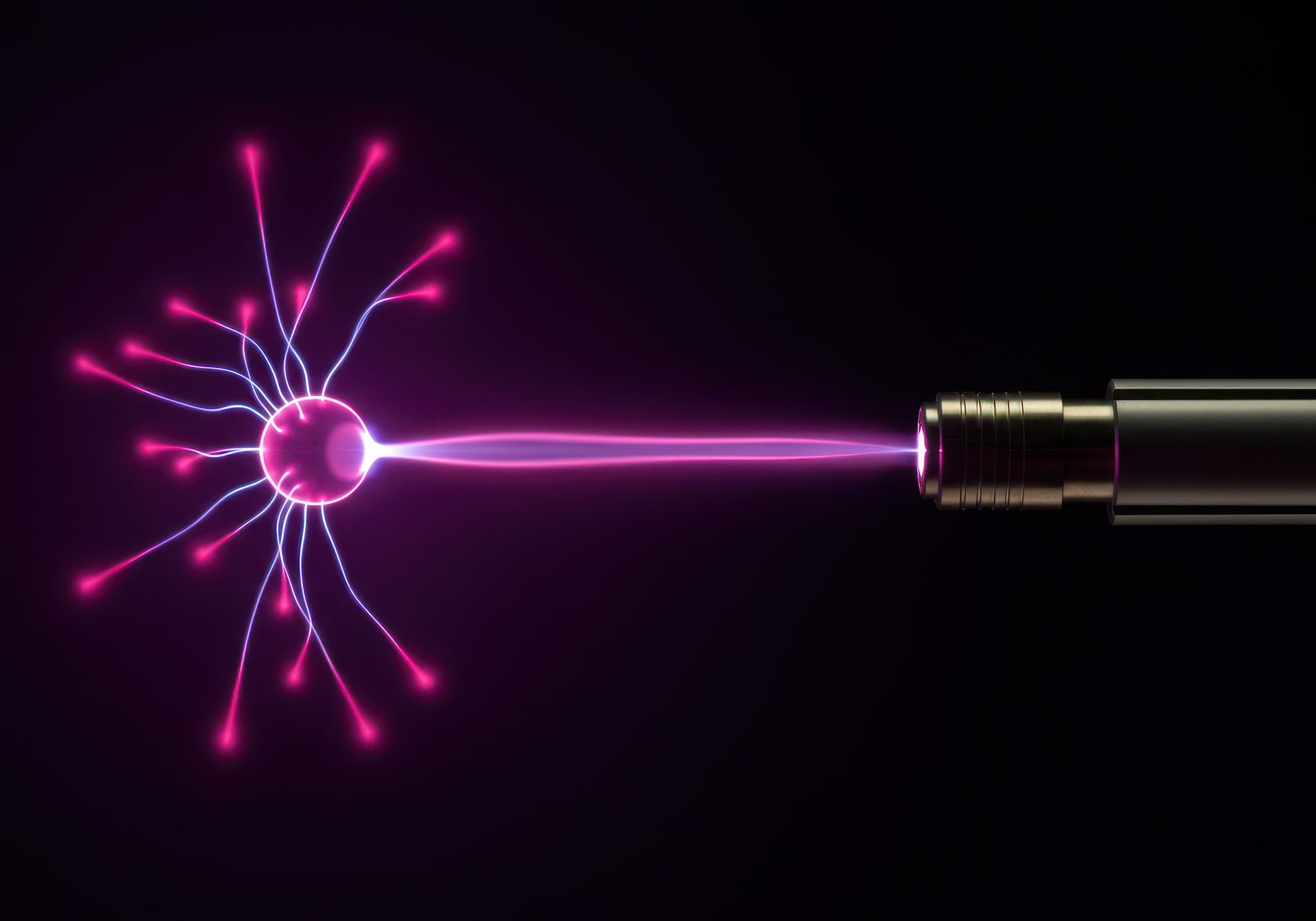 A bright purple electrical discharge from a plasma ball connecting to a metallic sensor or probe against a black backdrop.