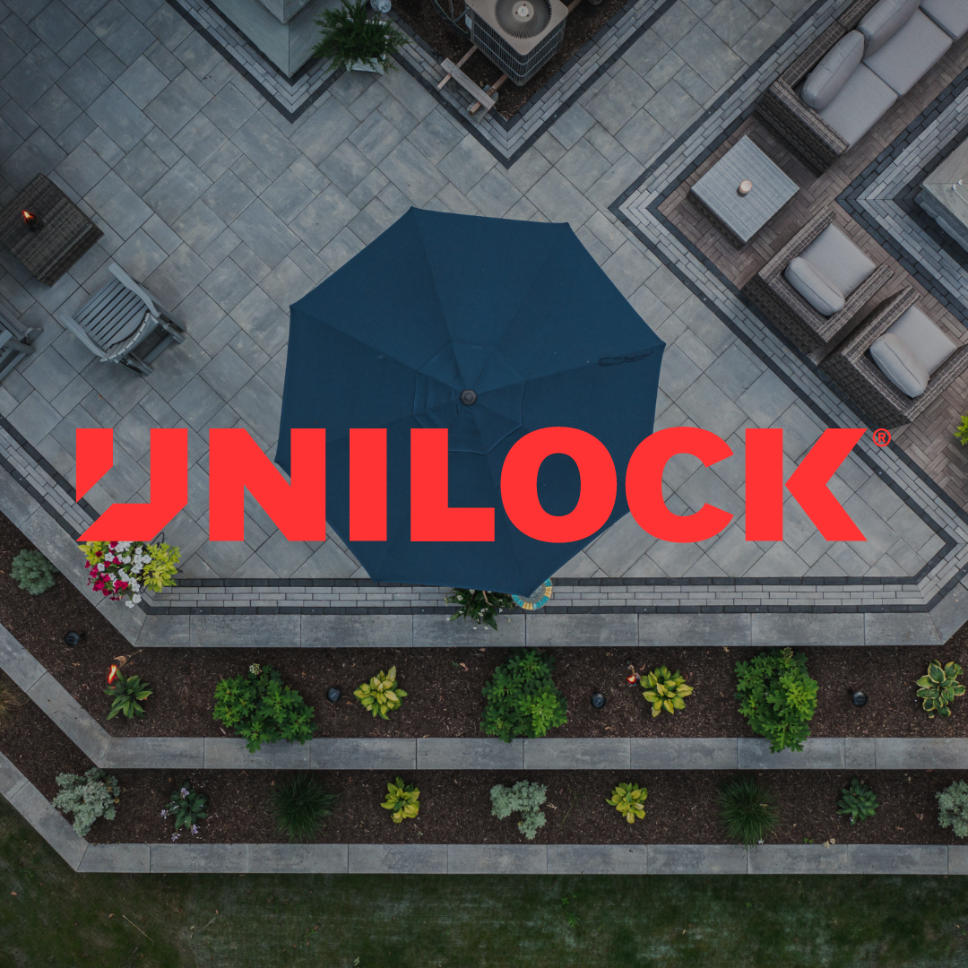 An aerial view of a patio with the word unilock in red