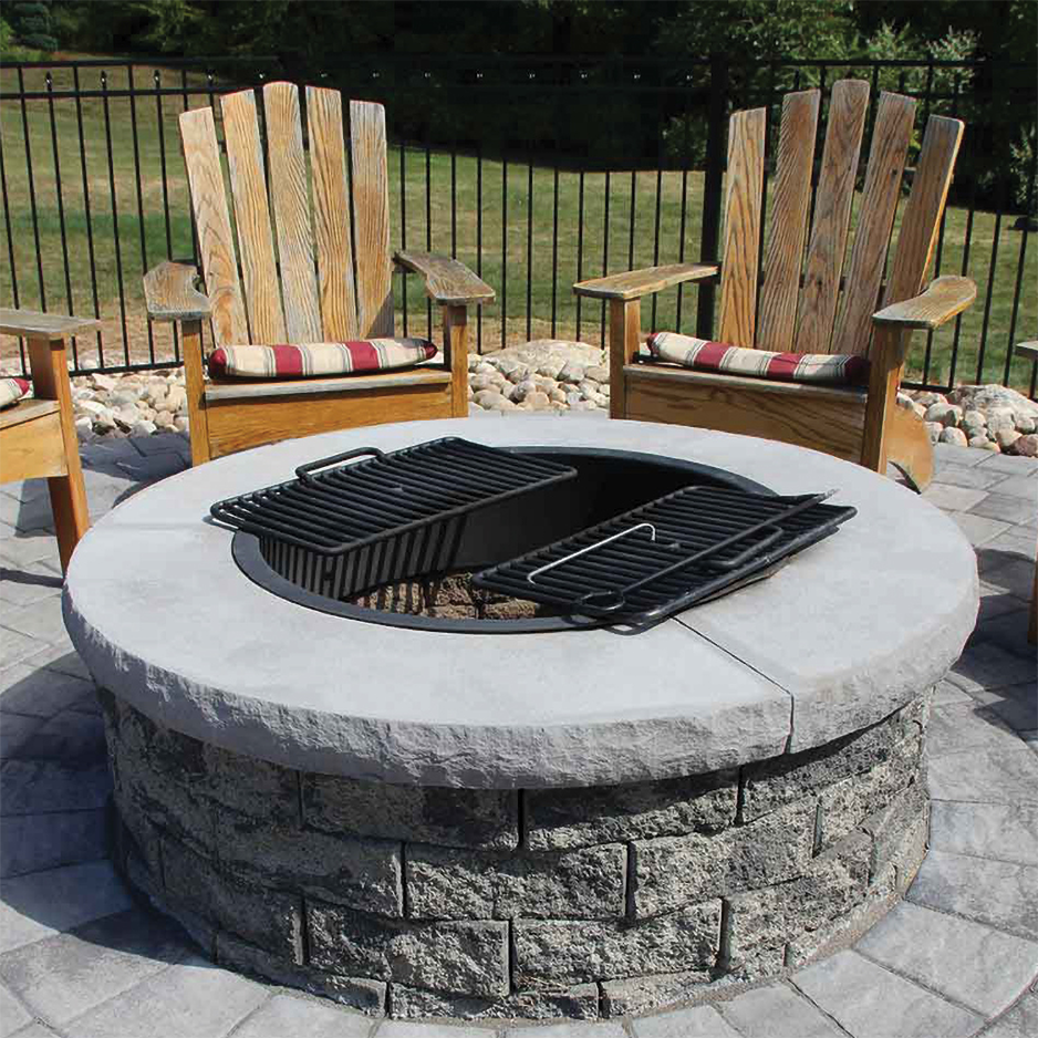 A fire pit surrounded by wooden chairs on a patio