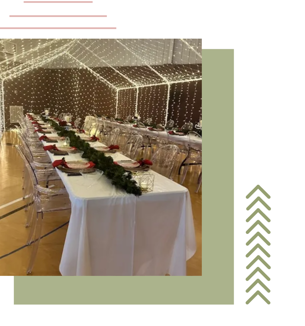 a long table with plates and glasses on it is sitting under a tent | event rentals