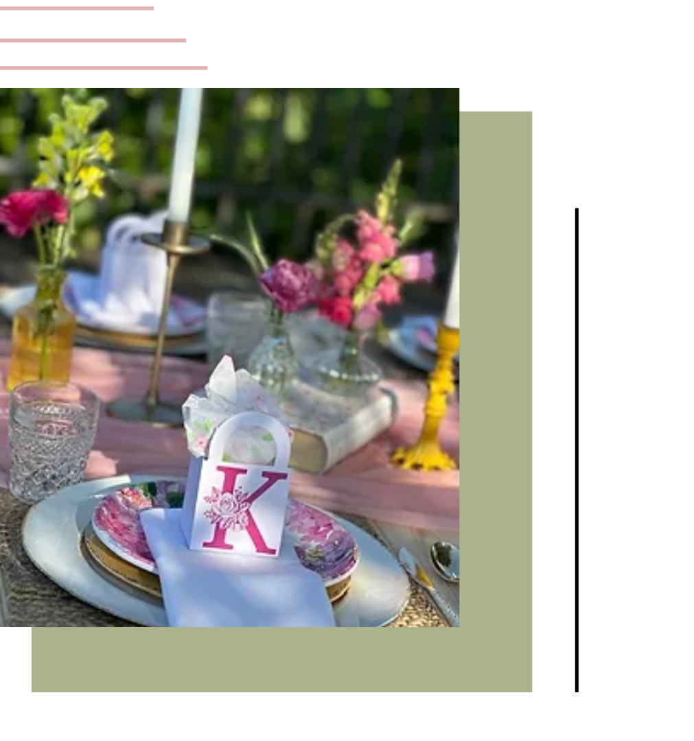 a table with plates candles flowers and a bag with the letter k on it | tent a rent