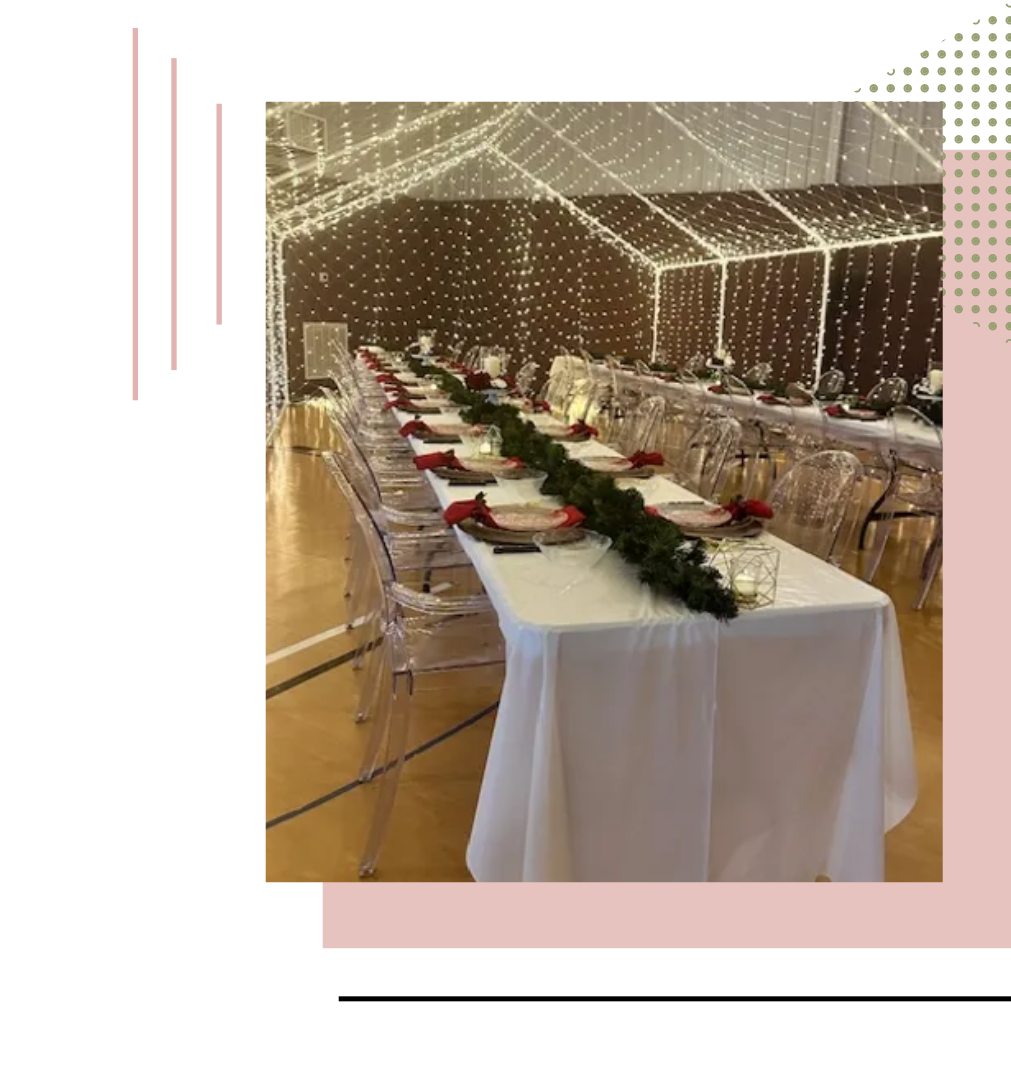 a long table with plates and glasses on it is sitting under a tent | event center russelville arkansas