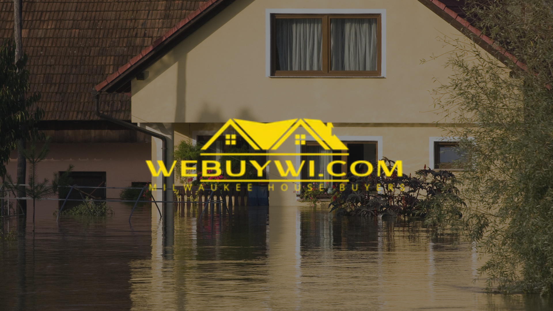 House partially submerged in floodwater with 