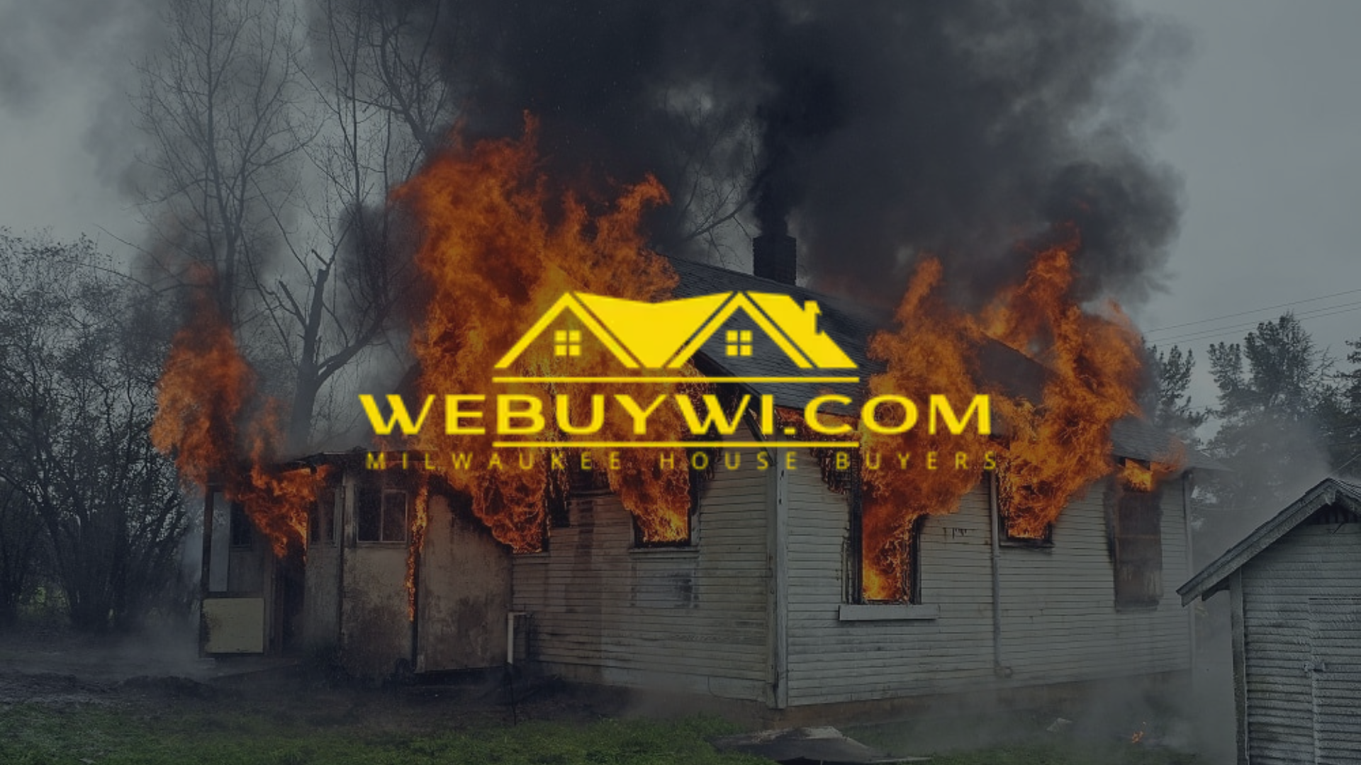 A house engulfed in flames with a 