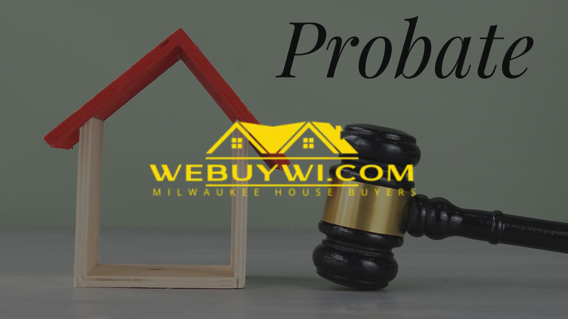 A gavel and a wooden house model with the word 