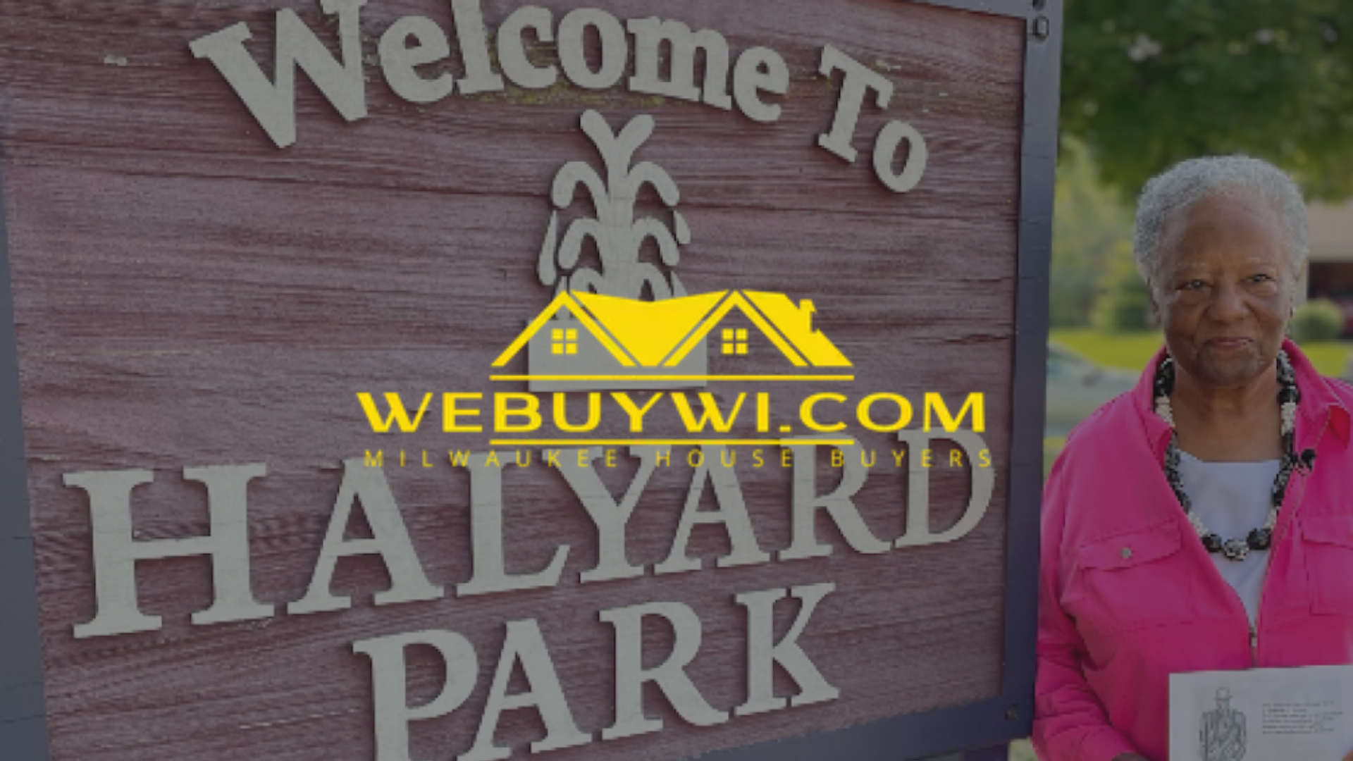 Woman in pink stands by a