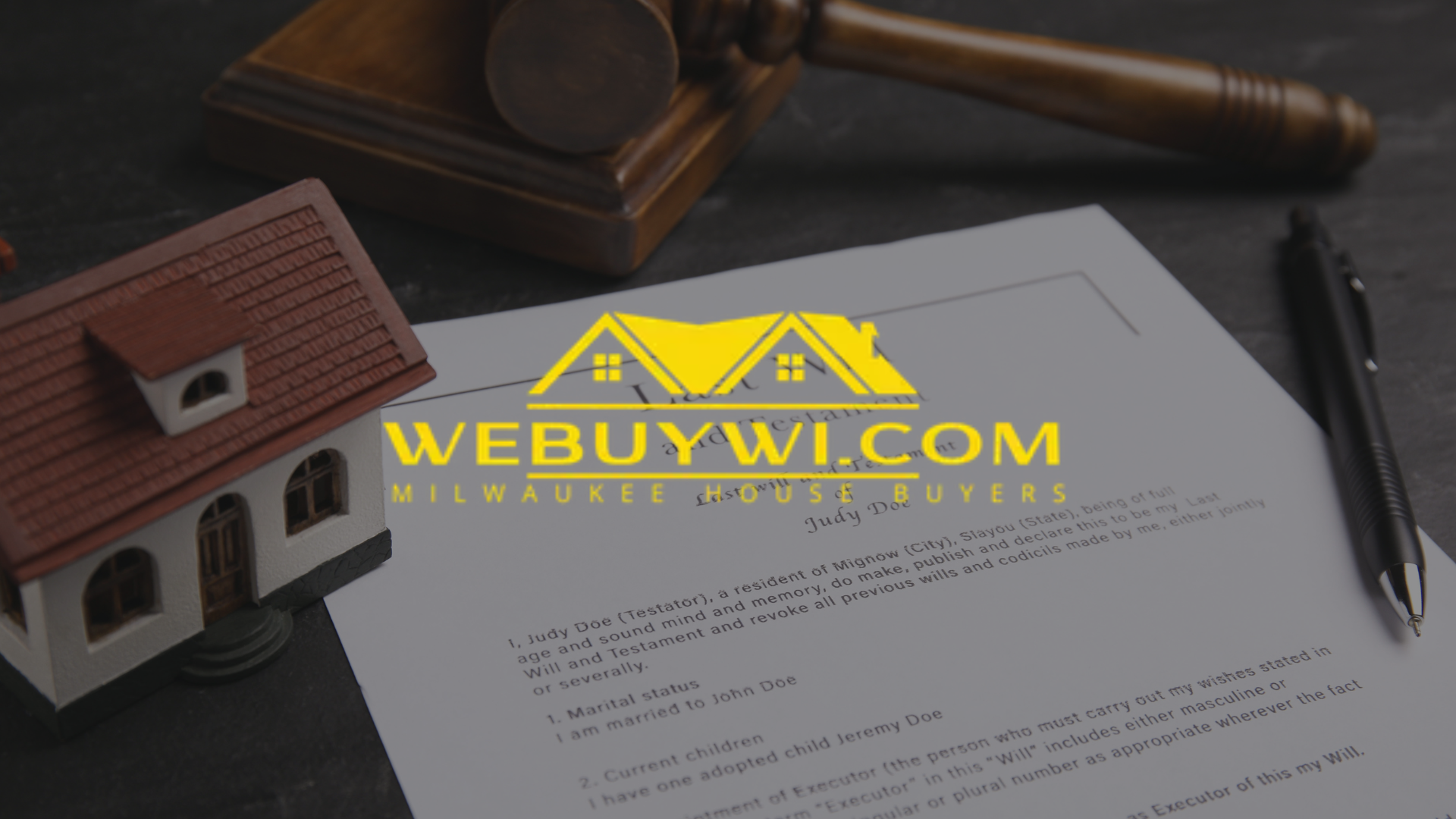 A gavel, document, and toy house with the logo