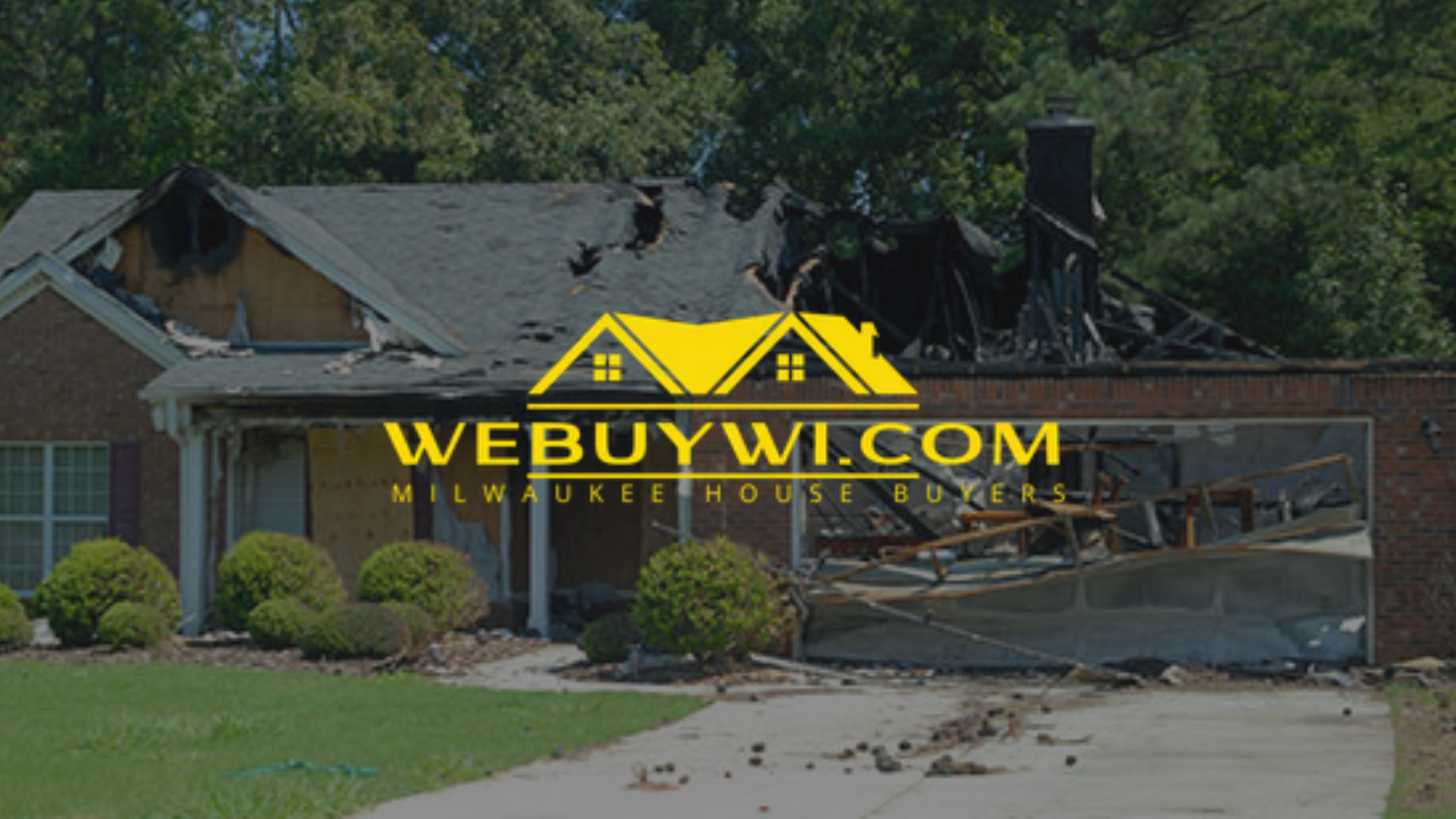 A house with significant fire damage to the roof and garage; a company logo 