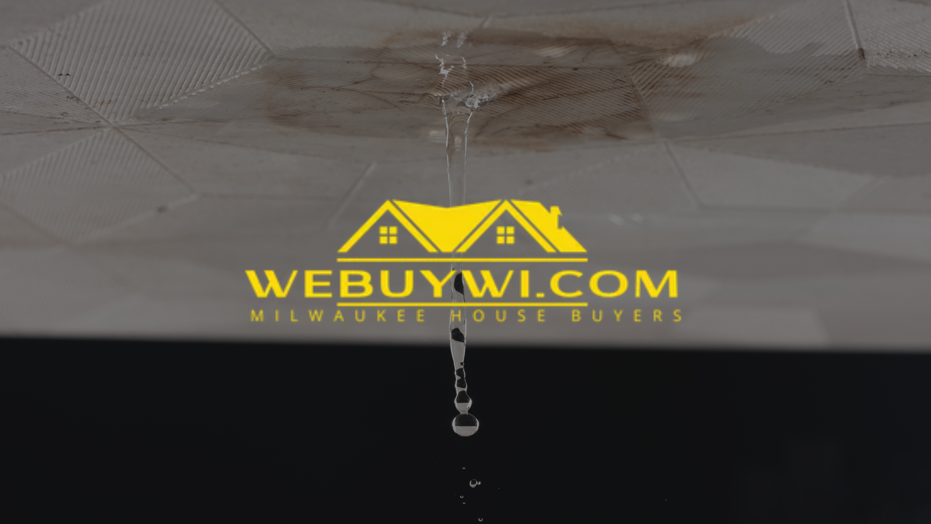 Water dripping from a stained ceiling with 