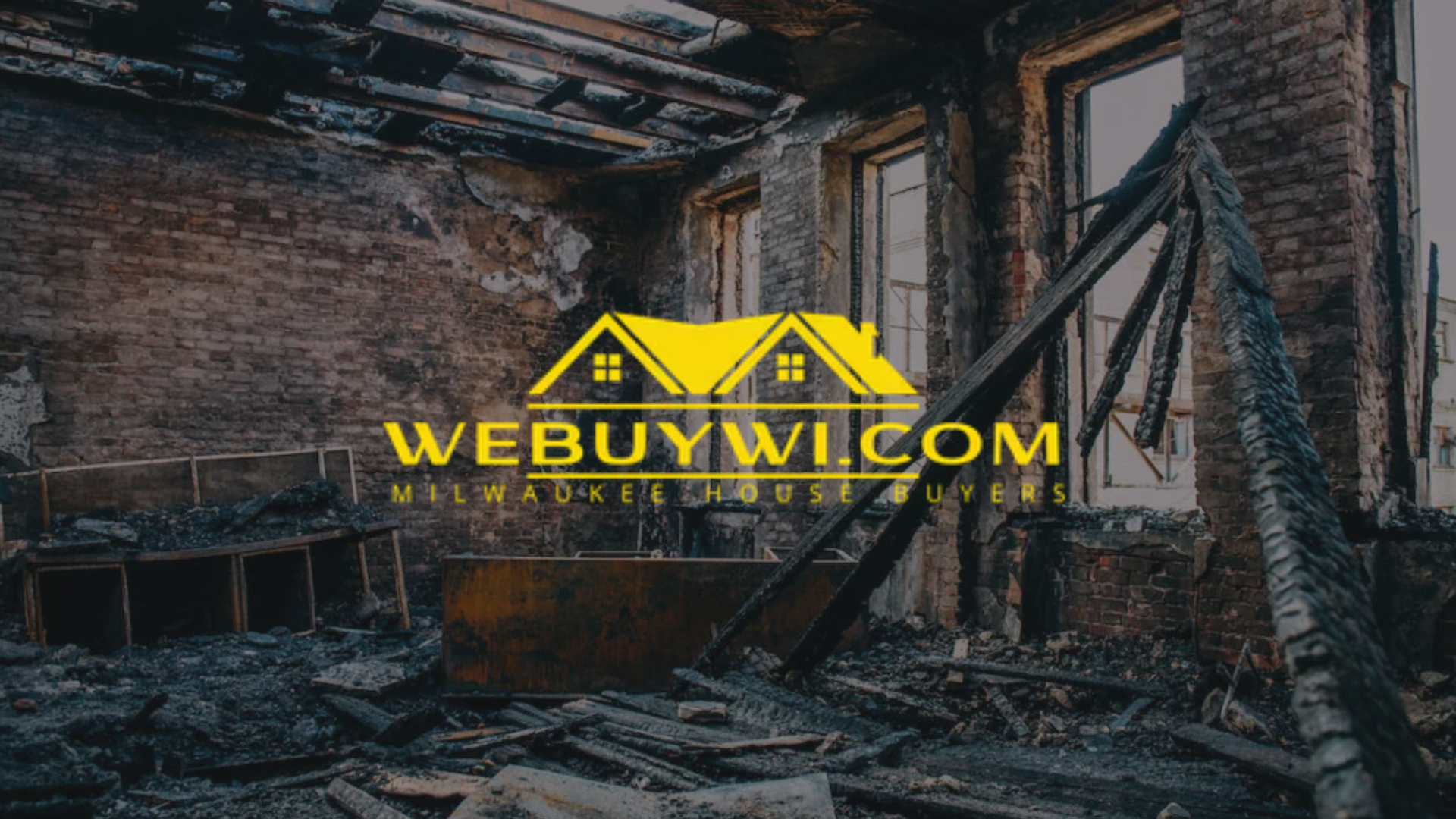 Fire-damaged house interior with a logo