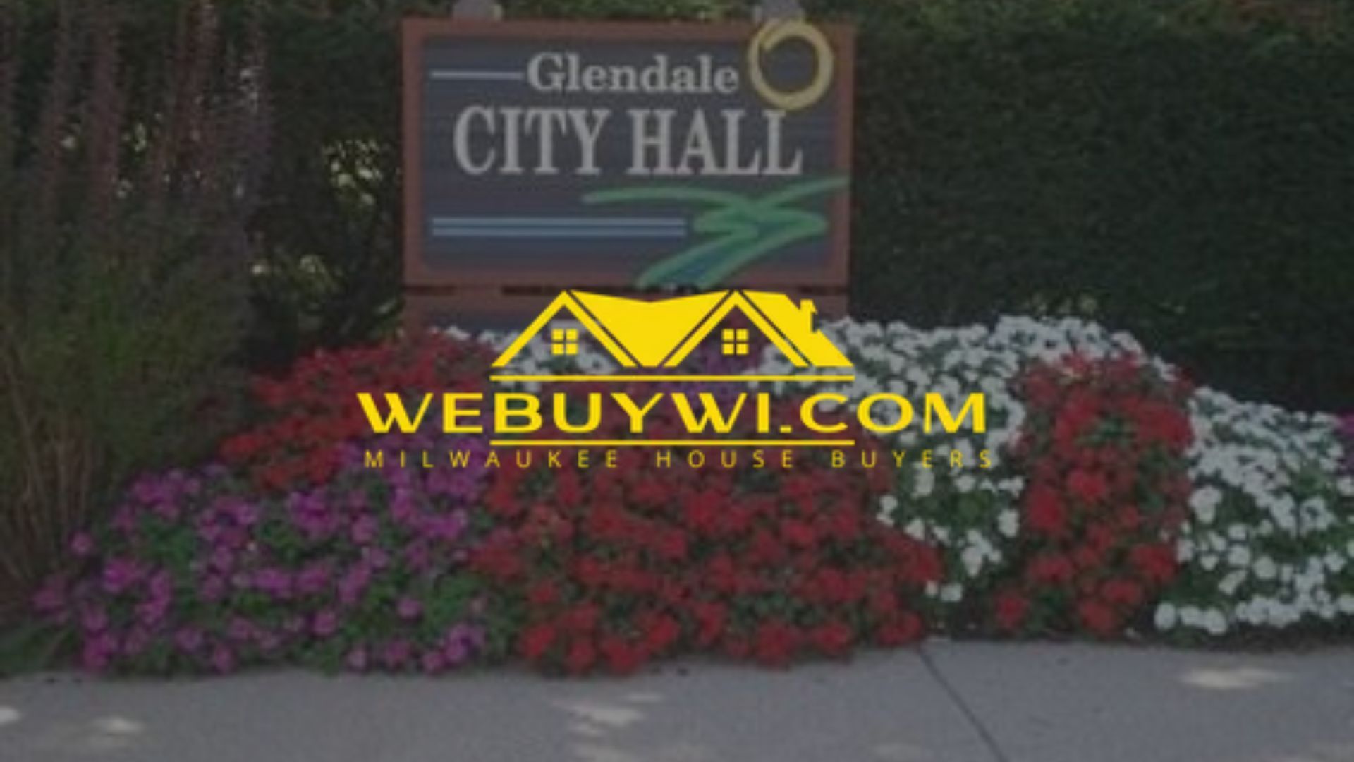 Glendale City Hall sign with flower garden in front; a website logo is overlaid on the flowers.