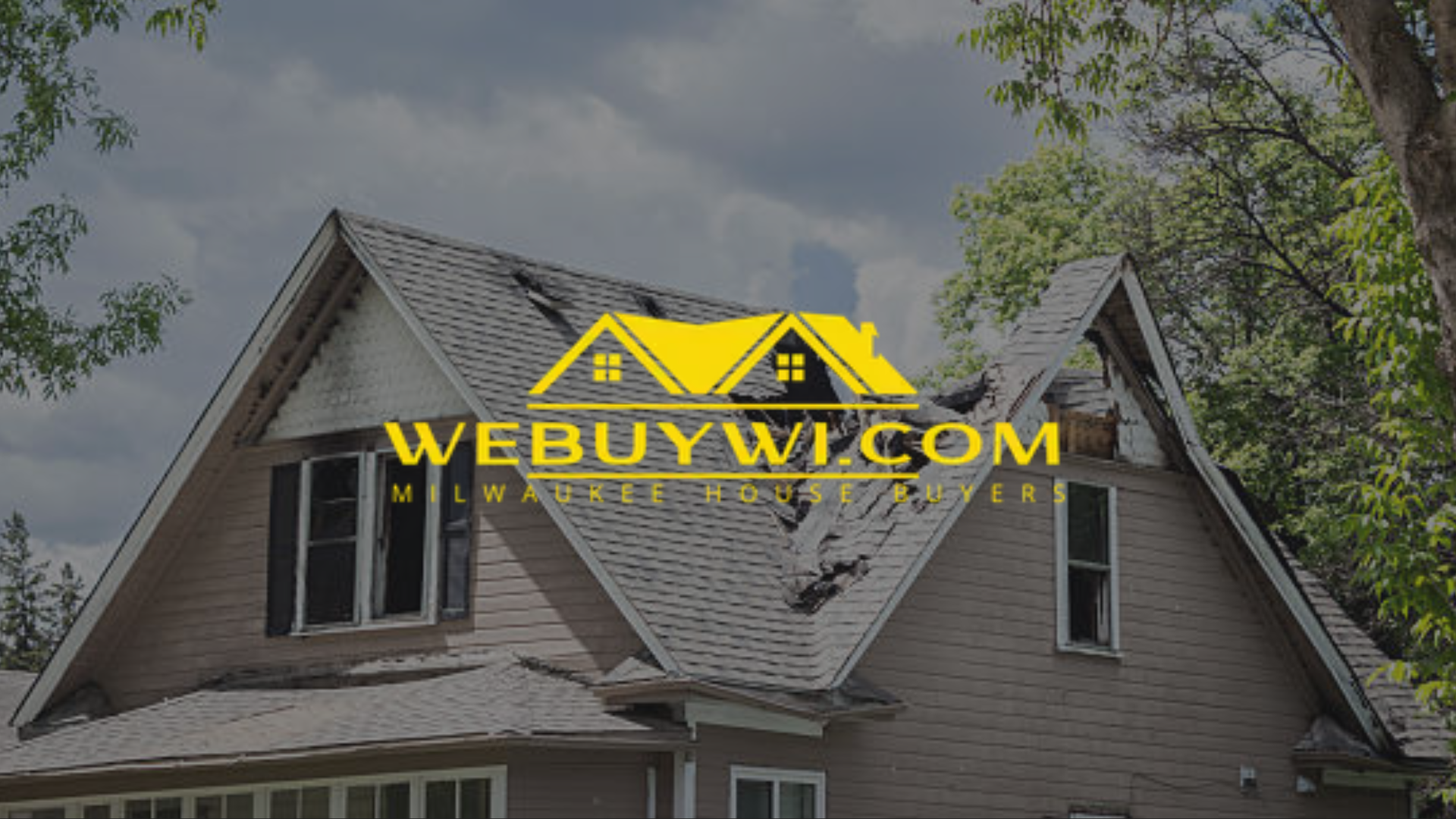 greenfield wi damaged house with a collapsed roof, possibly from fire damage. The company logo 