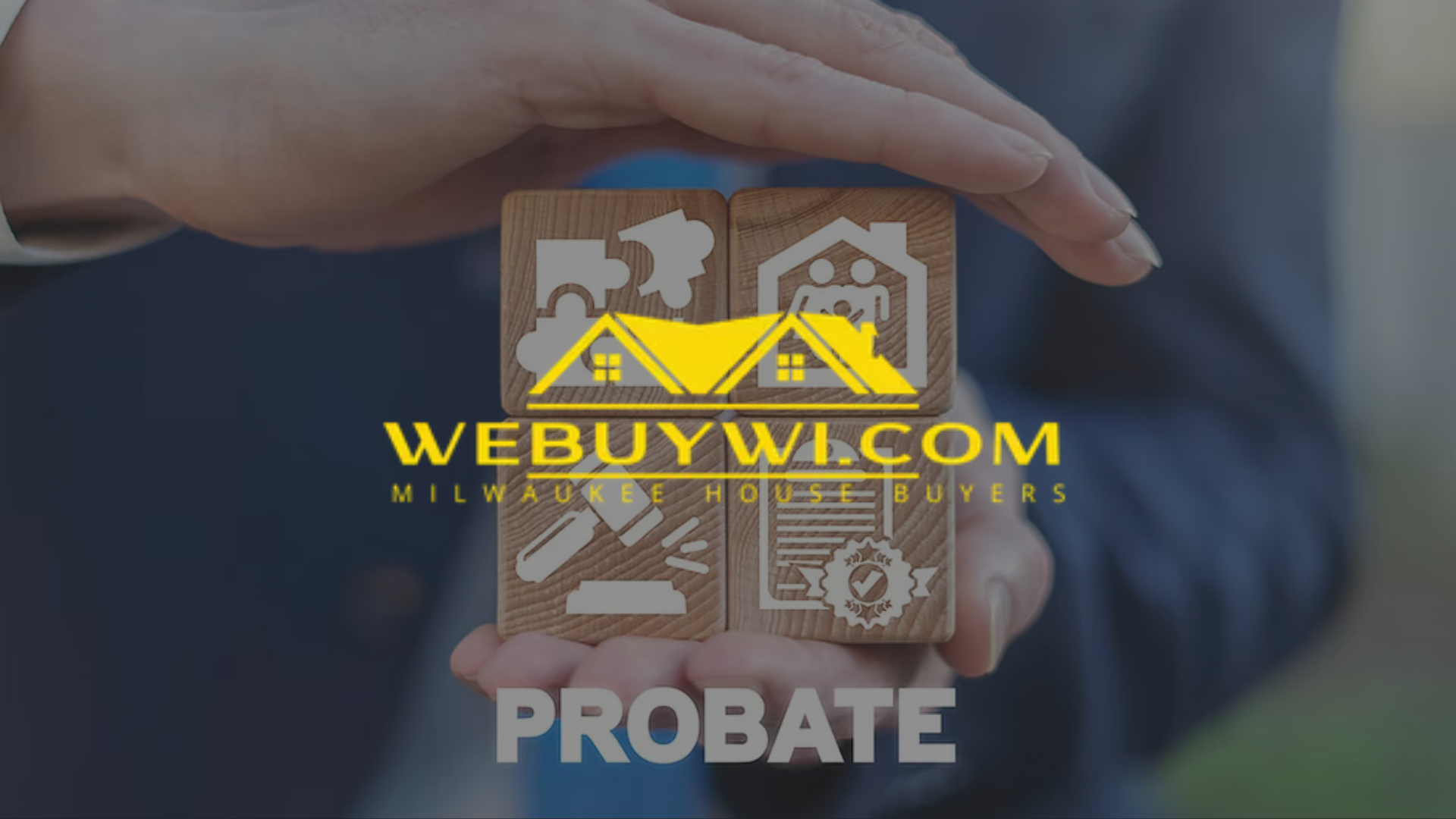 Hands holding wooden blocks with real estate icons and 