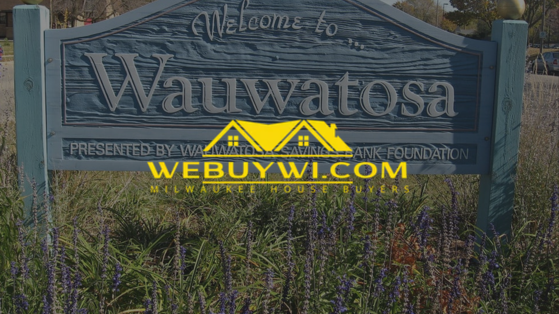 Sign for Wauwatosa with a WeBuyWI.com advertisement.