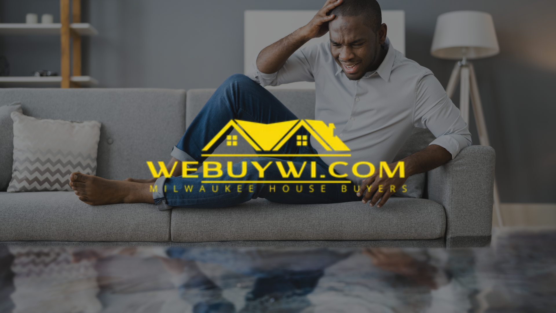 Man on sofa, distressed, hand on head. Website logo: WeBuyWI.com, Milwaukee House Buyers.