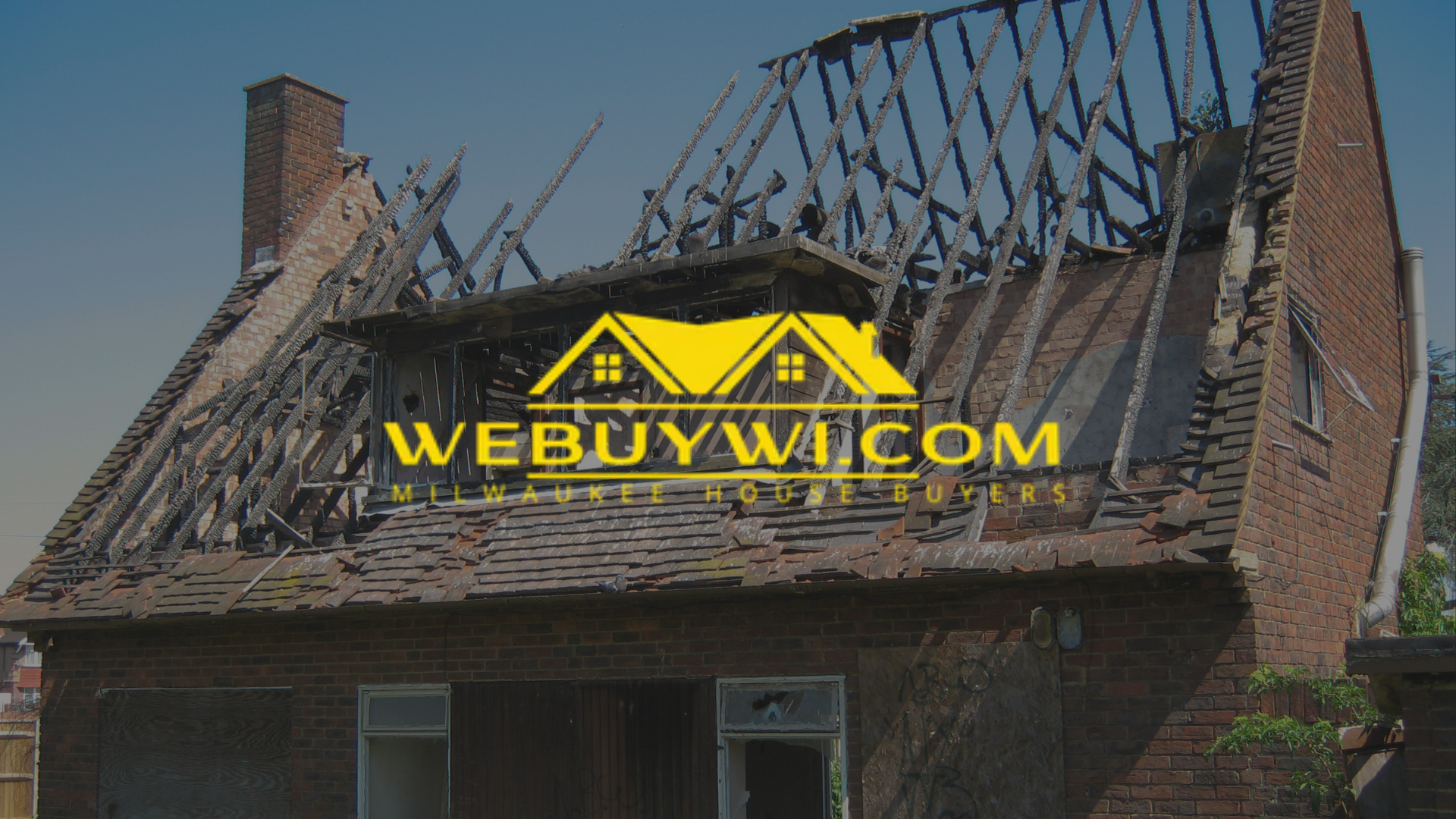 Fire-damaged house with a collapsed roof, branded with a “WE BUY WI” logo.