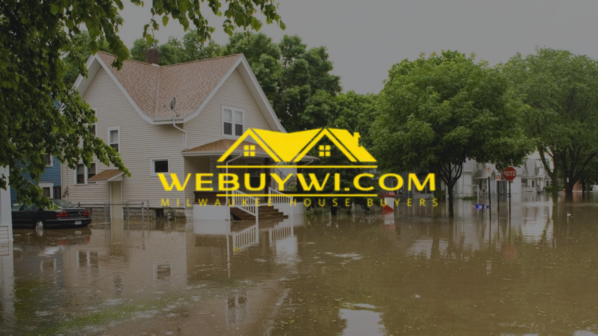 House submerged in flood water; WEBUYWI.COM logo overlaid.