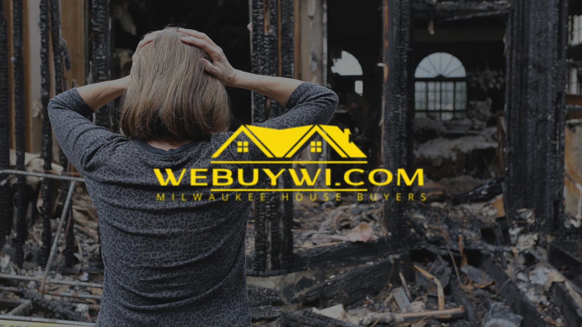 Woman with hands on head stands in front of a burnt-out house. Text: WEBUYWI.COM MILWAUKEE HOUSE BUYERS.