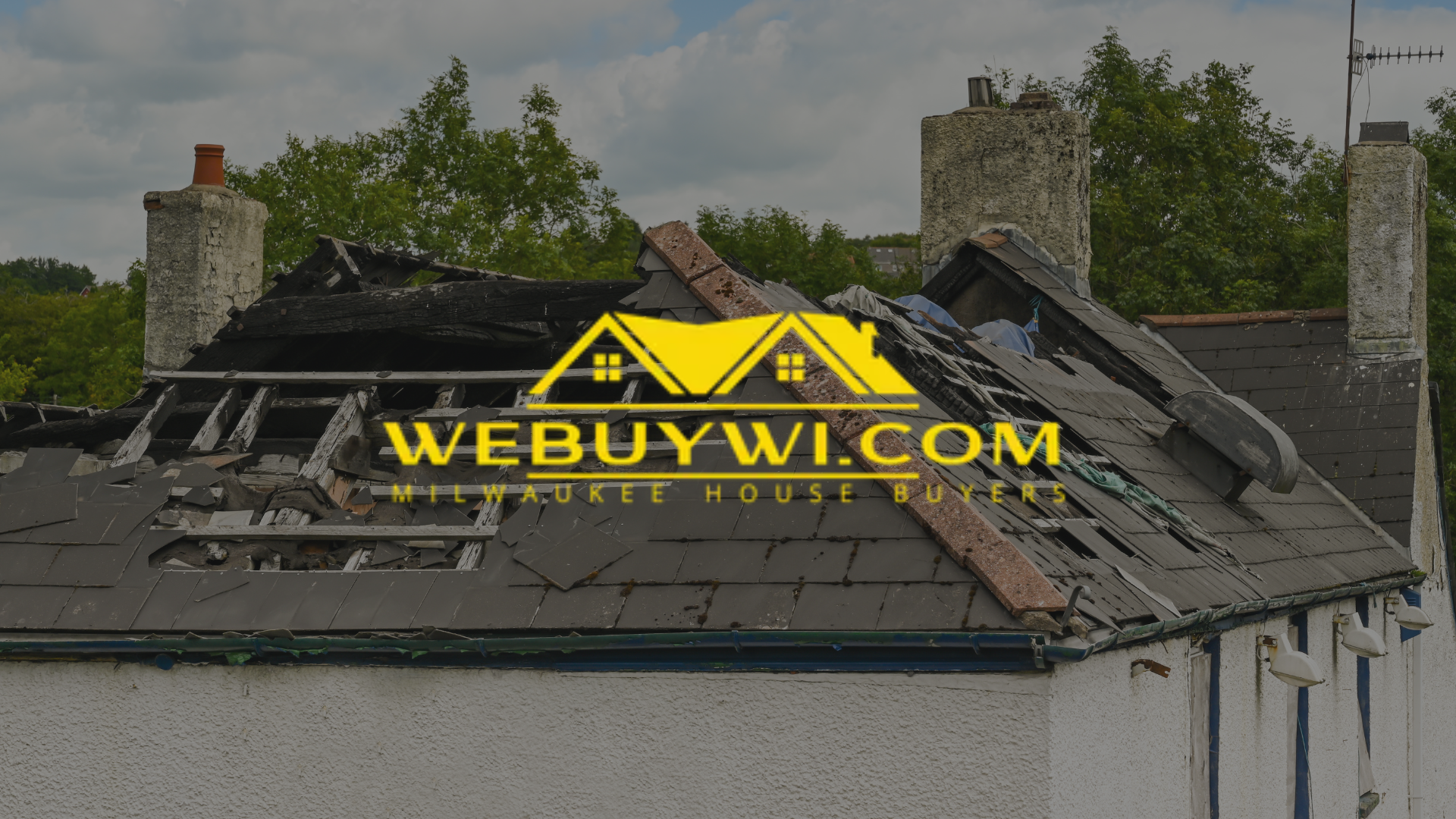 Damaged roof on a white house with a chimney; 