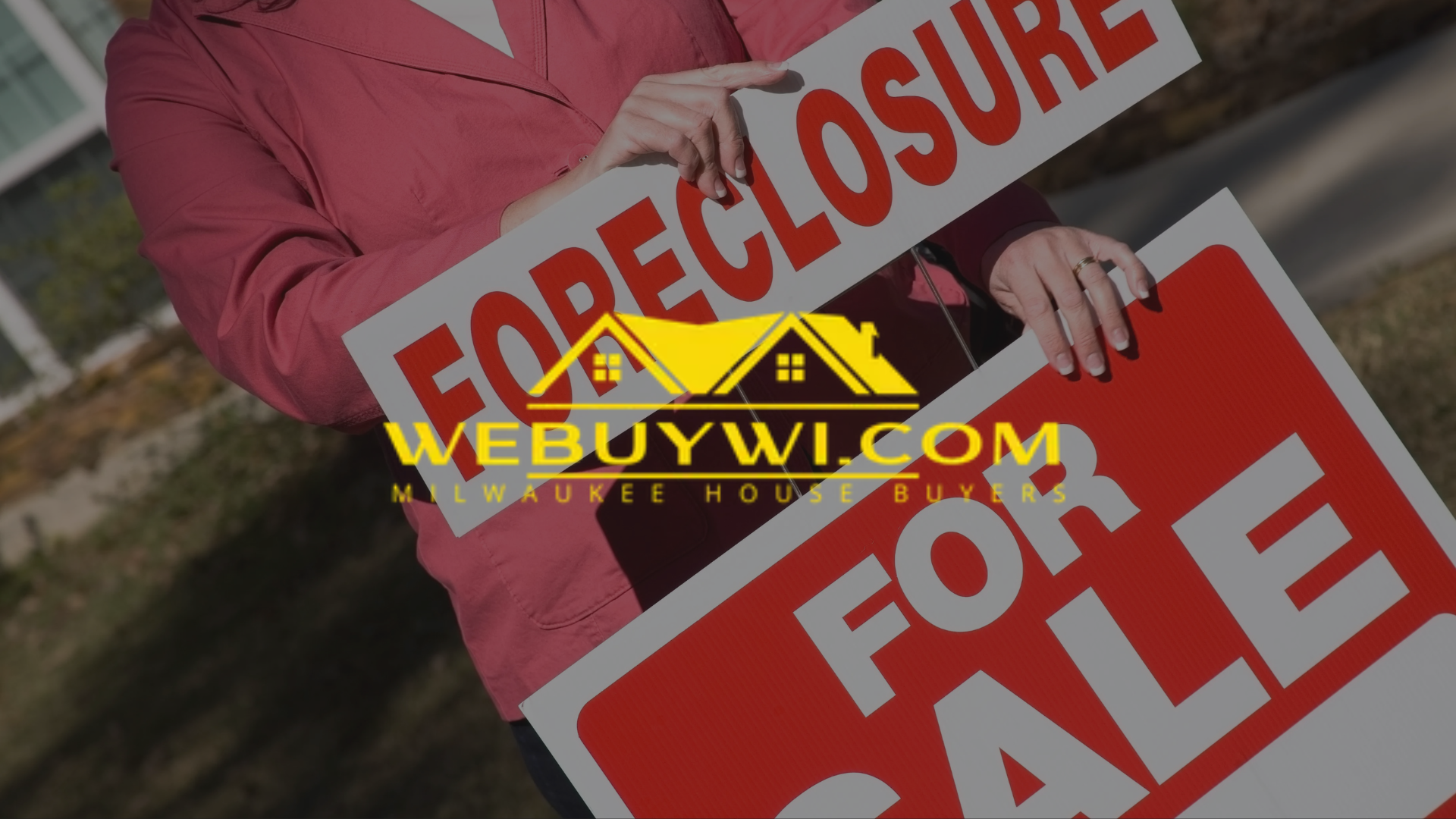 A woman is holding a foreclosure sign and a for sale sign with webuywi.com logo on top