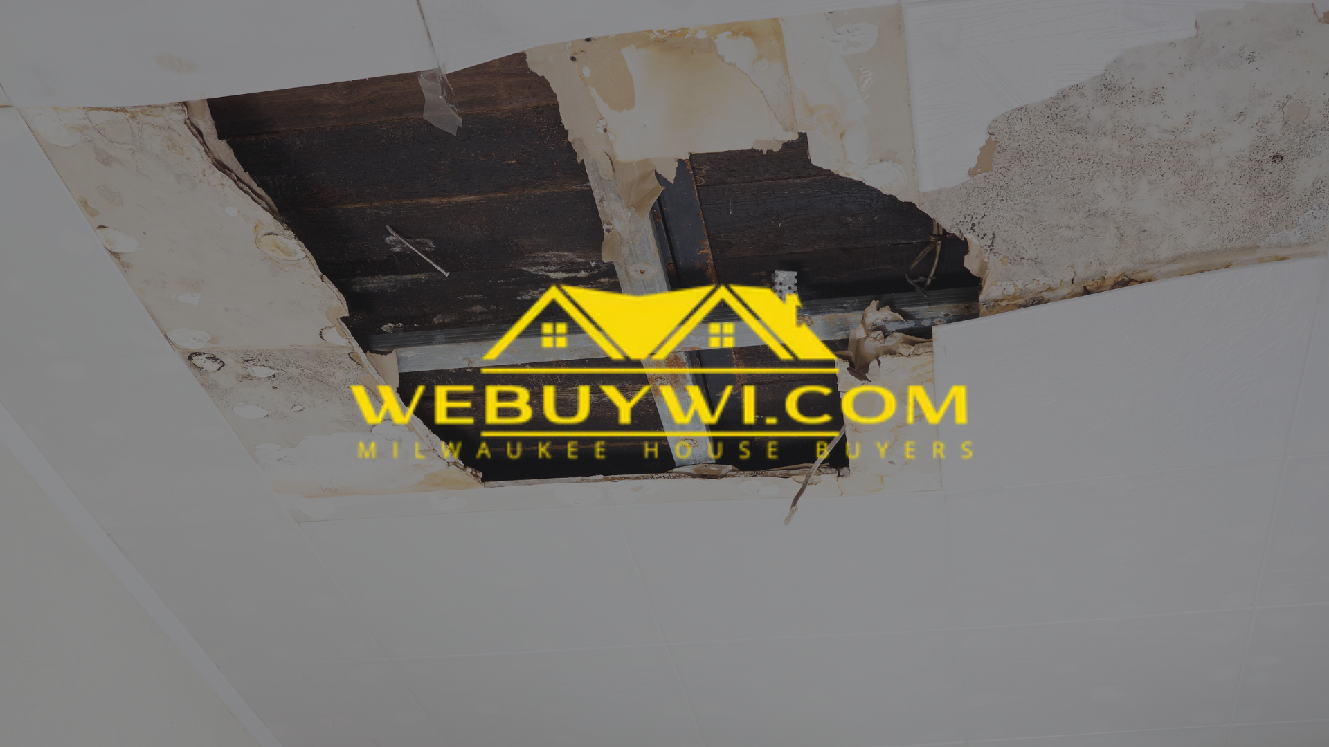A hole in the ceiling with the website webuywi.com written on it symbolizing water damage in waukesha with webuywi.com logo overlaid on top