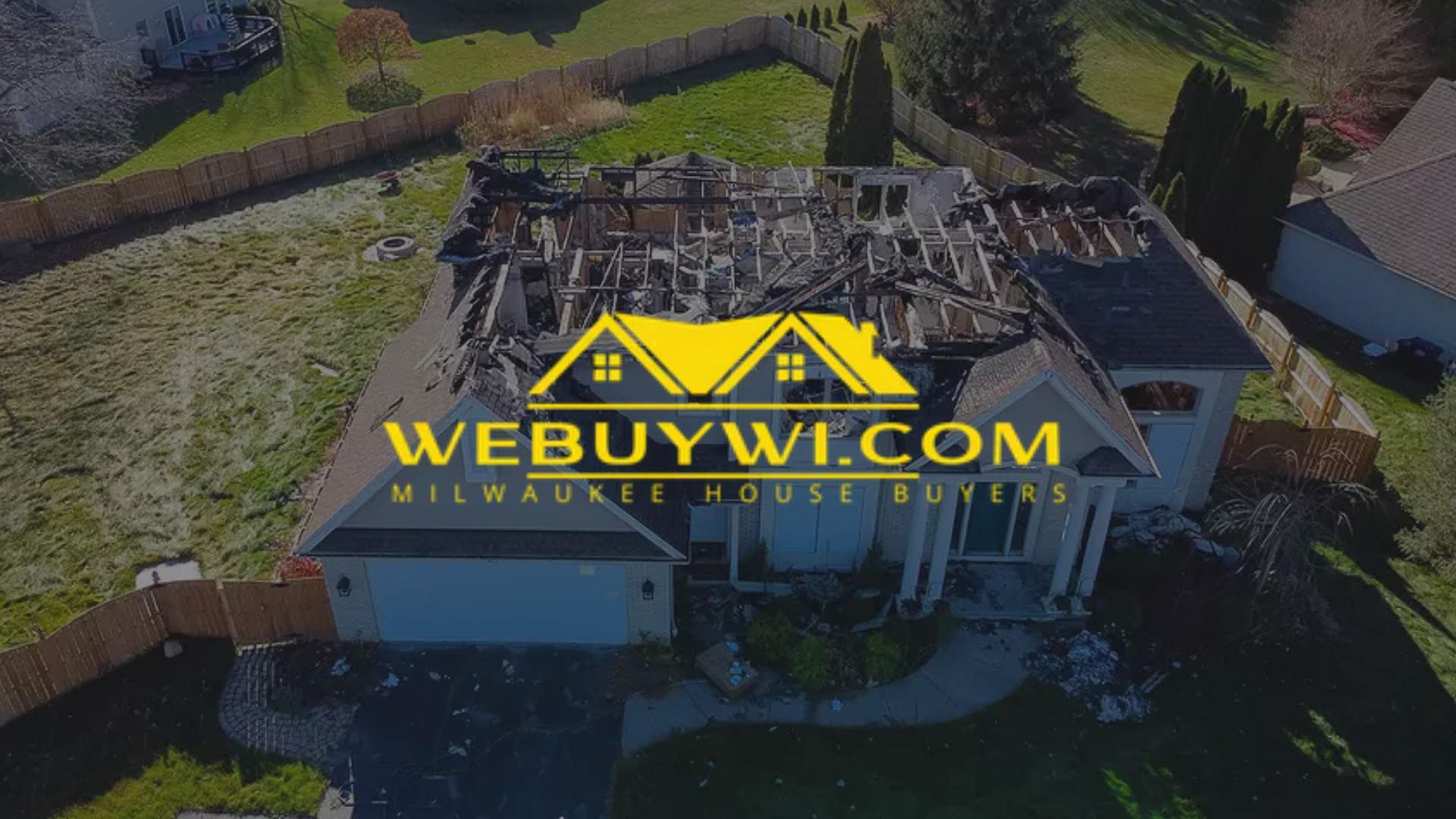 A house with a severely damaged, burnt roof; a WeBuyWI.com logo overlaid.