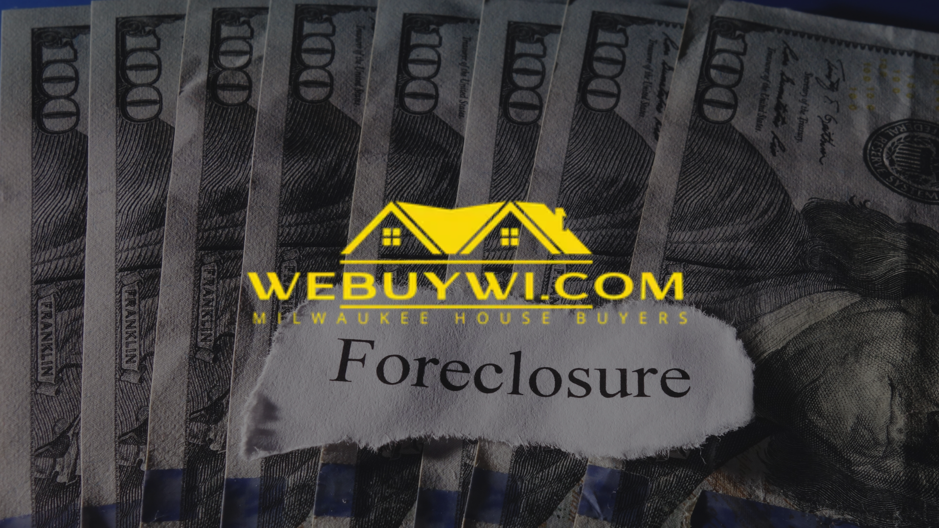 Pile of hundred dollar bills with a torn