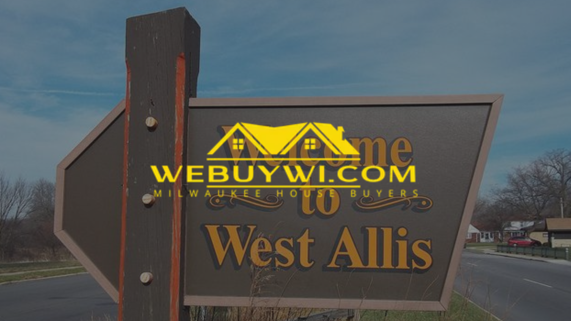 Sign welcoming visitors to West Allis, Wisconsin, with a WeBuyWI.com logo.