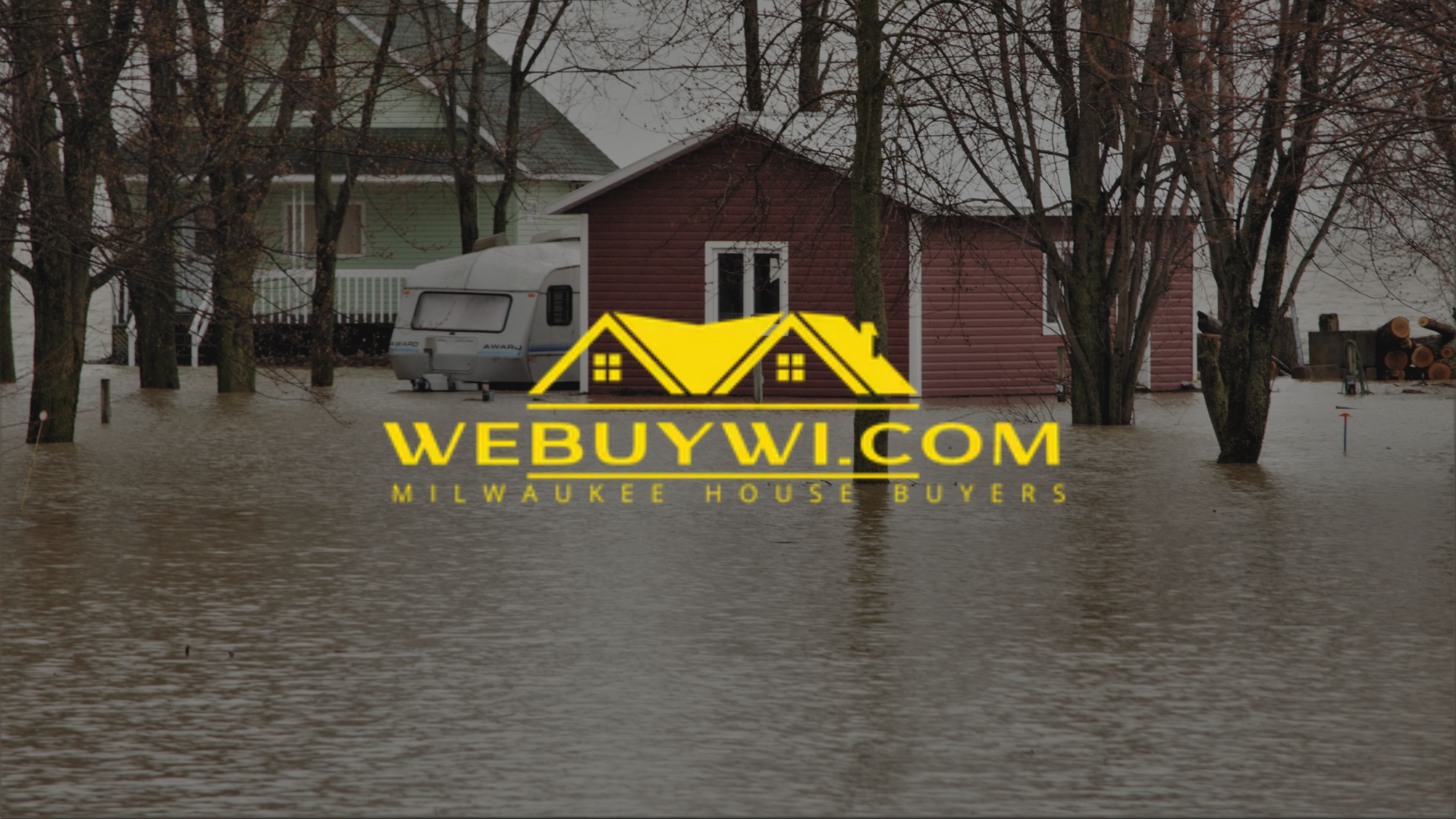 Flooded house and RV with high water, trees in water. webuywi.com Website logo in foreground.