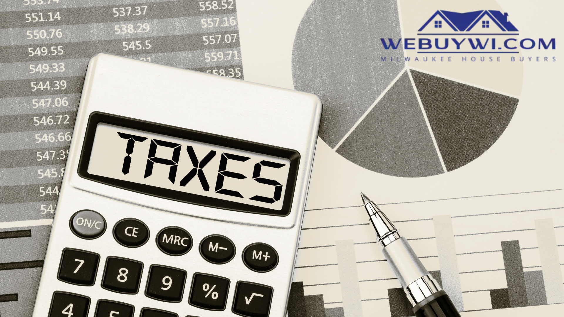 A calculator with the word taxes written on it
