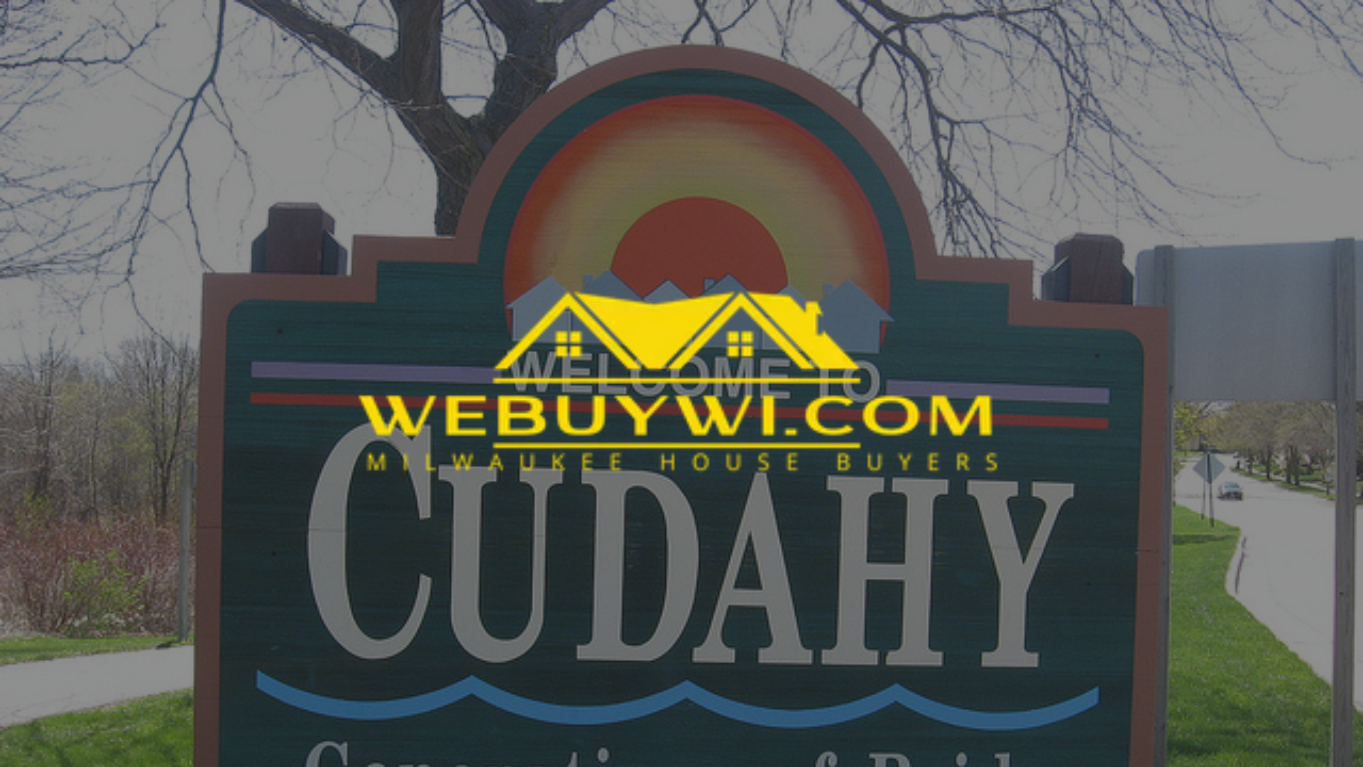 Cudahy, Wisconsin welcome sign with colorful sun design and