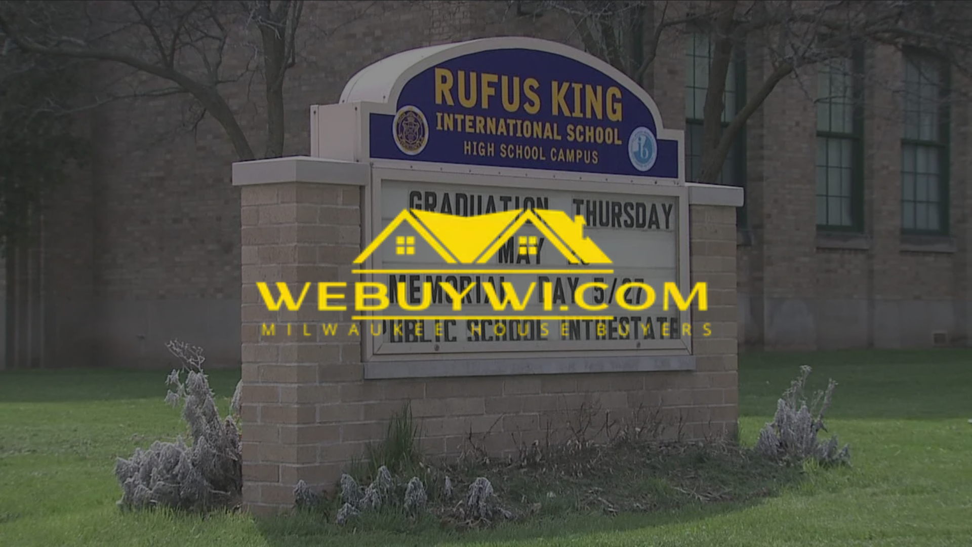 Rufus King International High School sign, brick building exterior, graduation announcement.