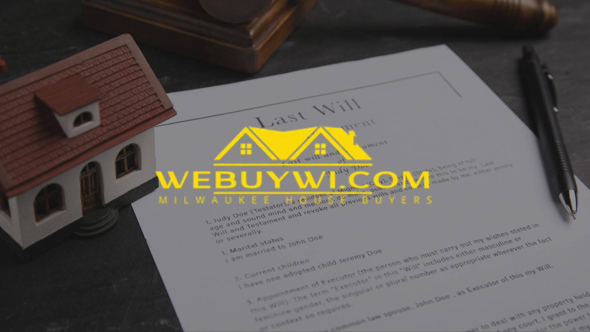 House model, will document, and pen on a table, with