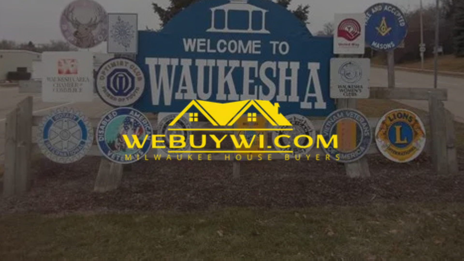 A sign that says welcome to waukesha on it