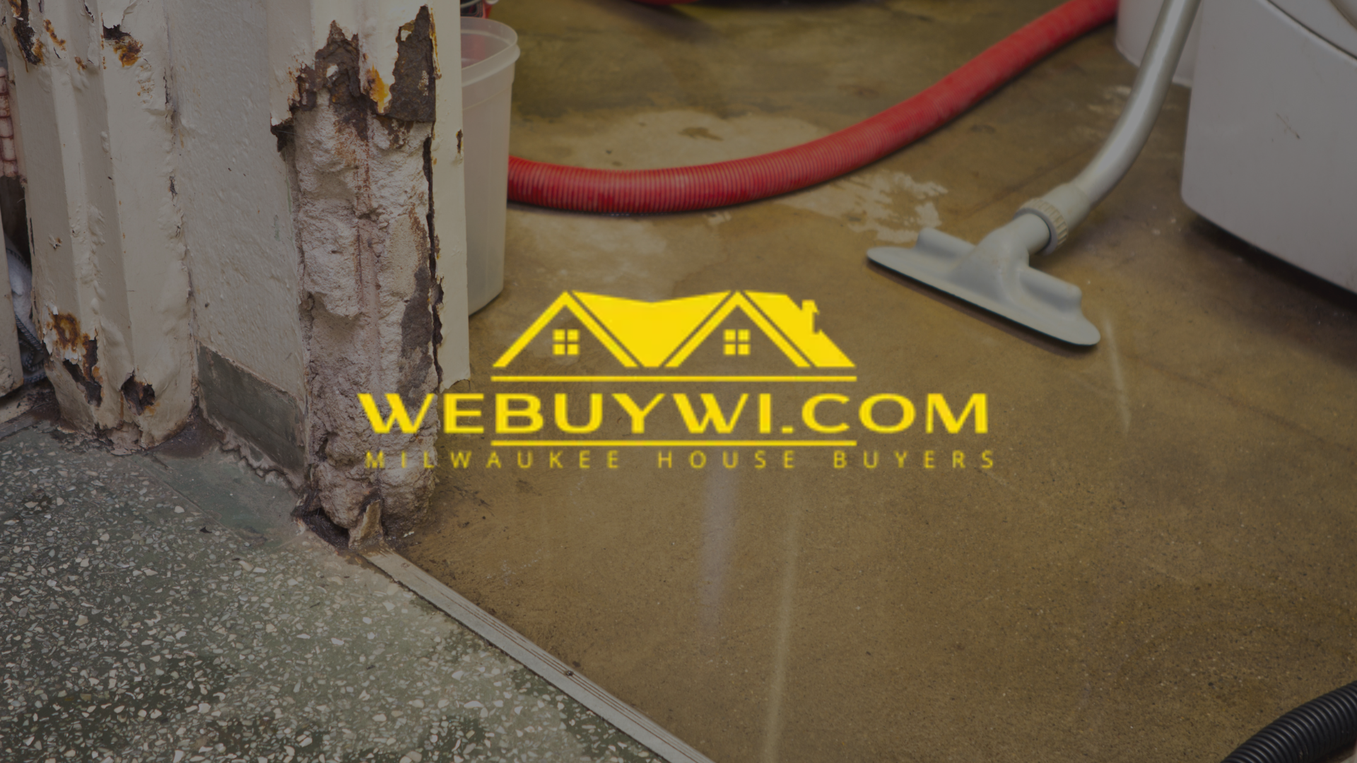 A vacuum cleaner is sitting on the floor next to a wall symbolizing water damage with webuywi.com logo on top