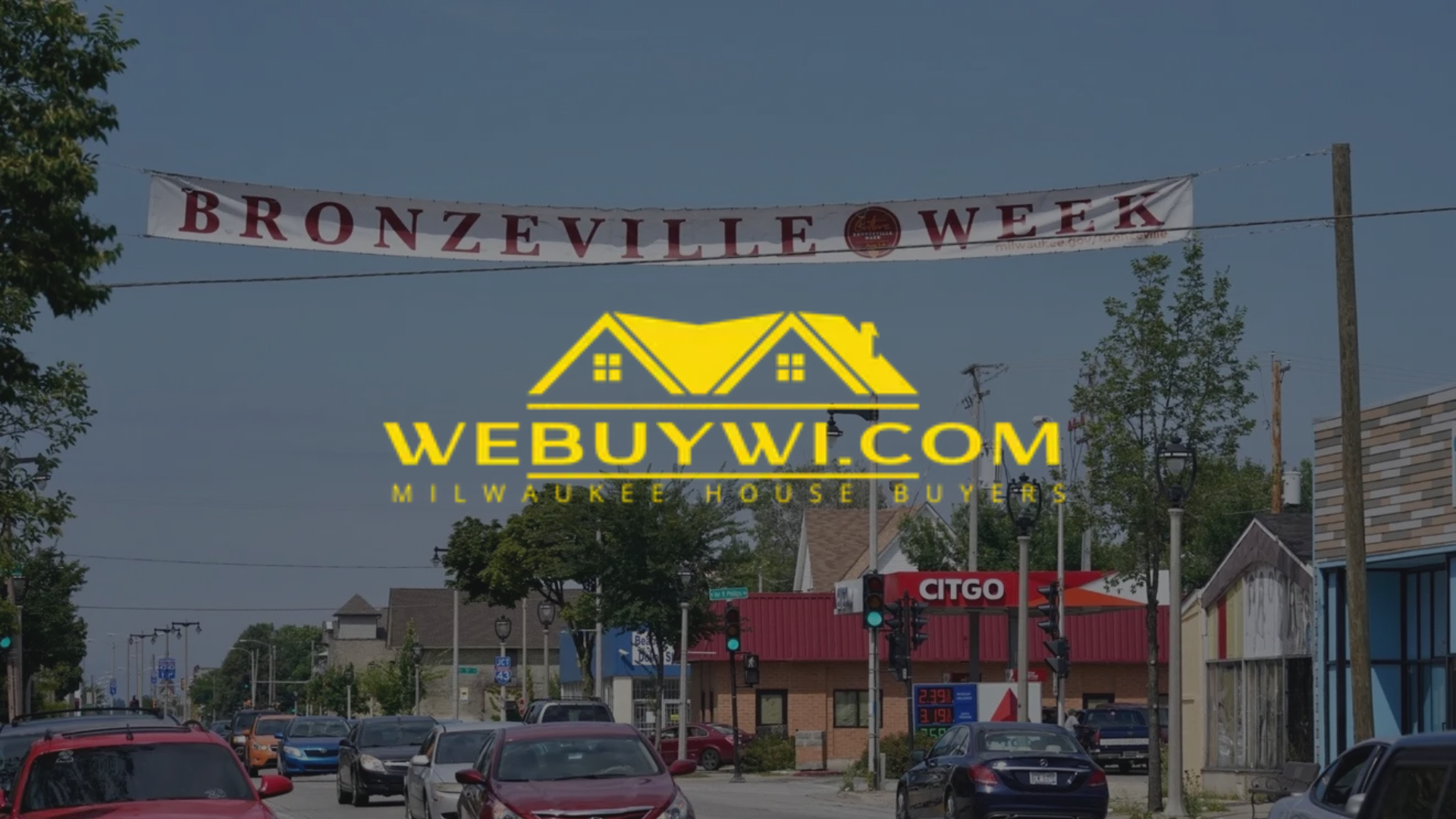 Bronzeville Week banner over a Milwaukee street with cars, buildings, and WEBUYWI.COM logo.