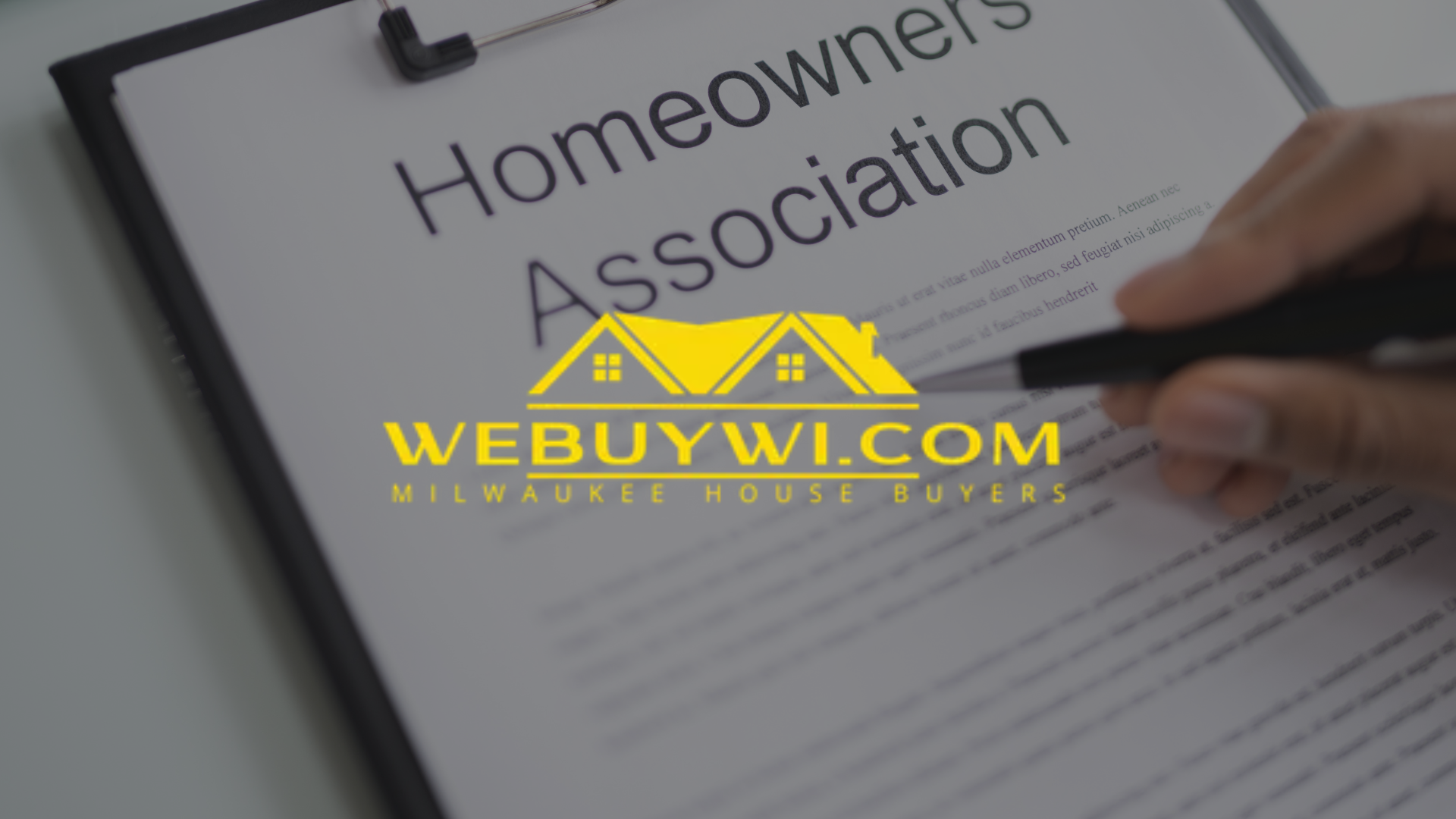 Hand signing document titled 