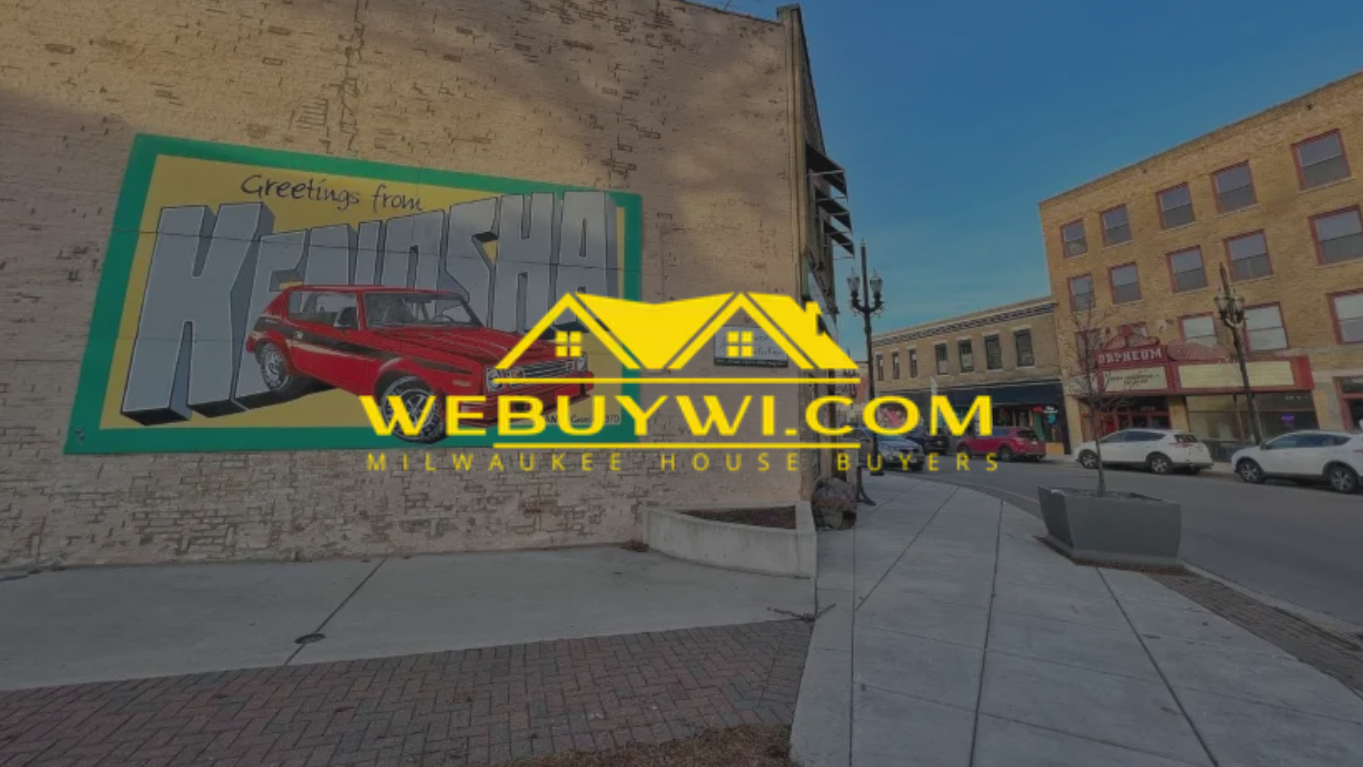 Graffiti art on brick wall, street scene in Kenosha with 