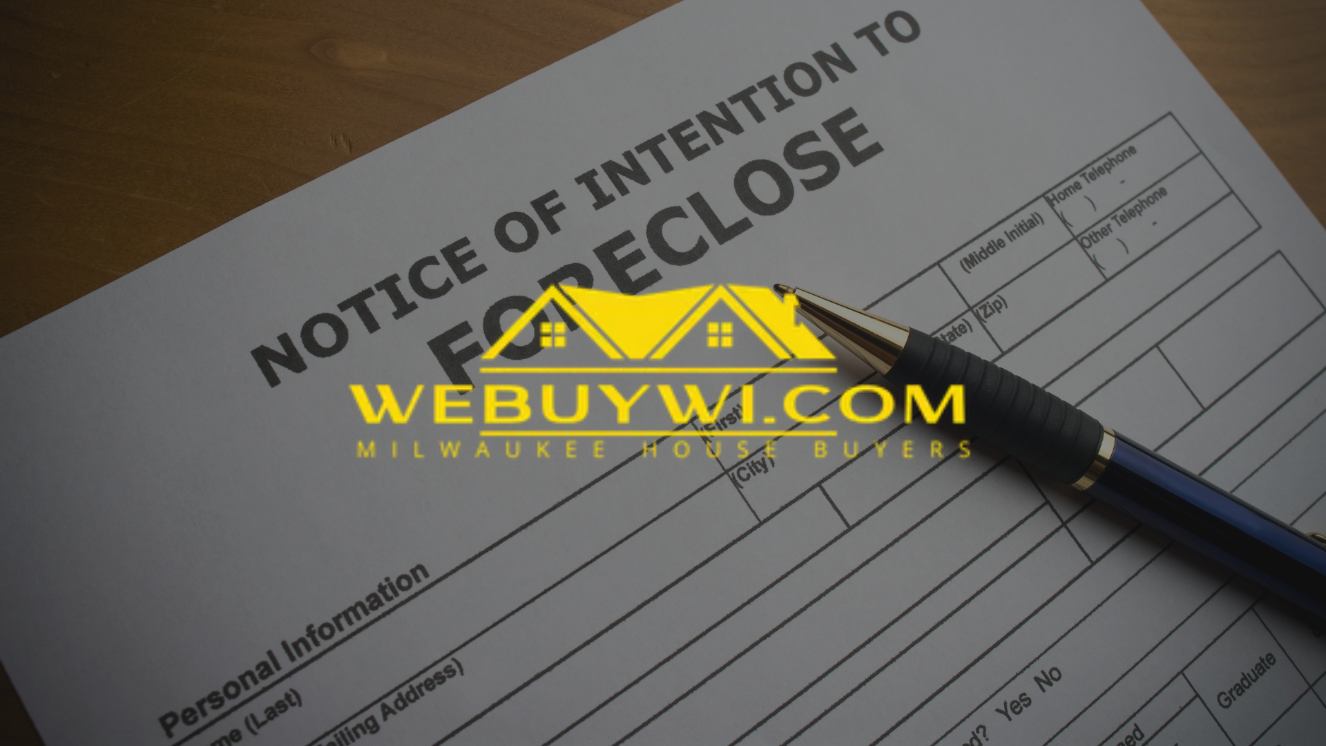 A pen is sitting on top of a notice of intention to foreclose form.