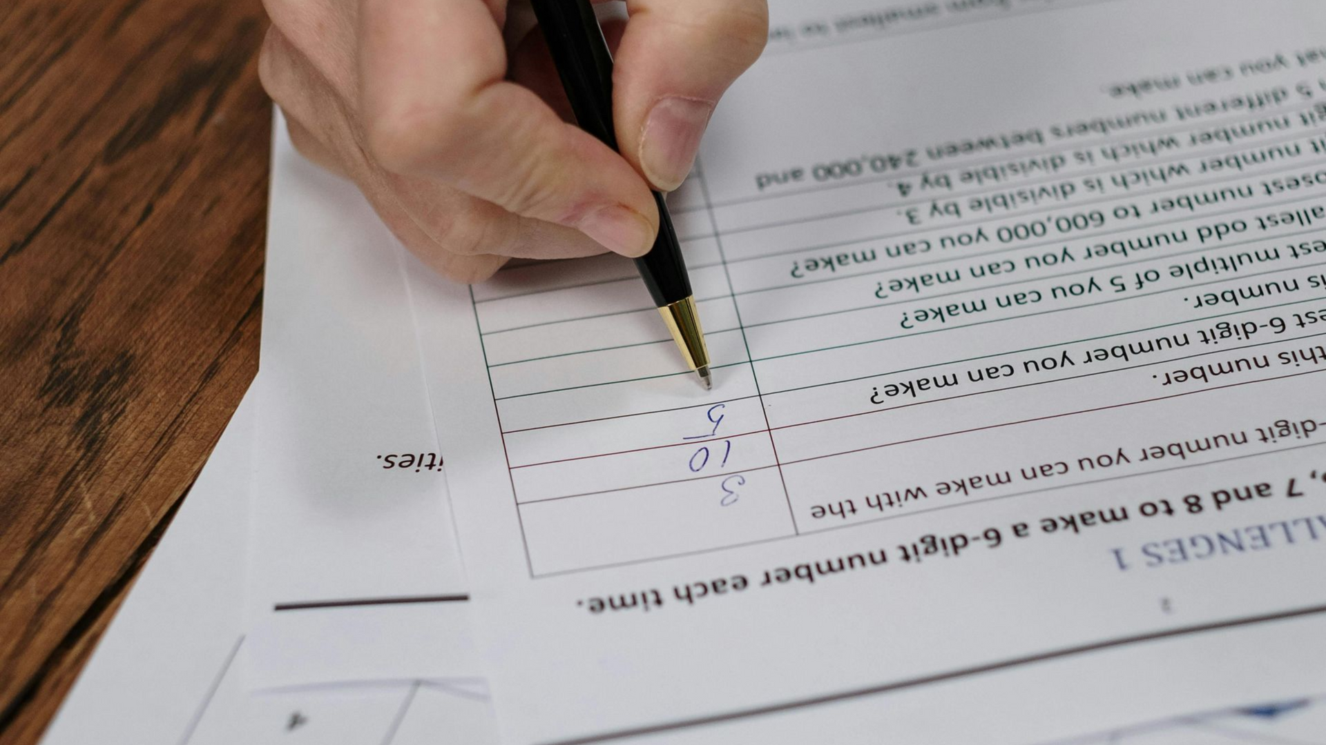Key with house charm and moving icons on a cardboard box, suggesting relocation and new home.