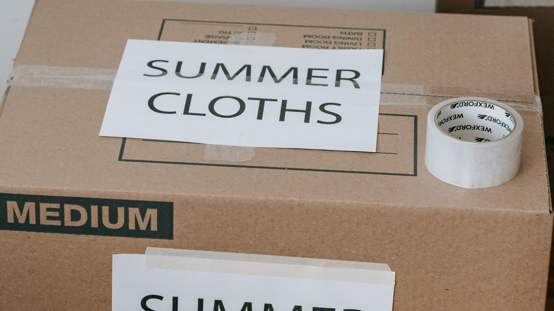 A medium-sized cardboard box labeled