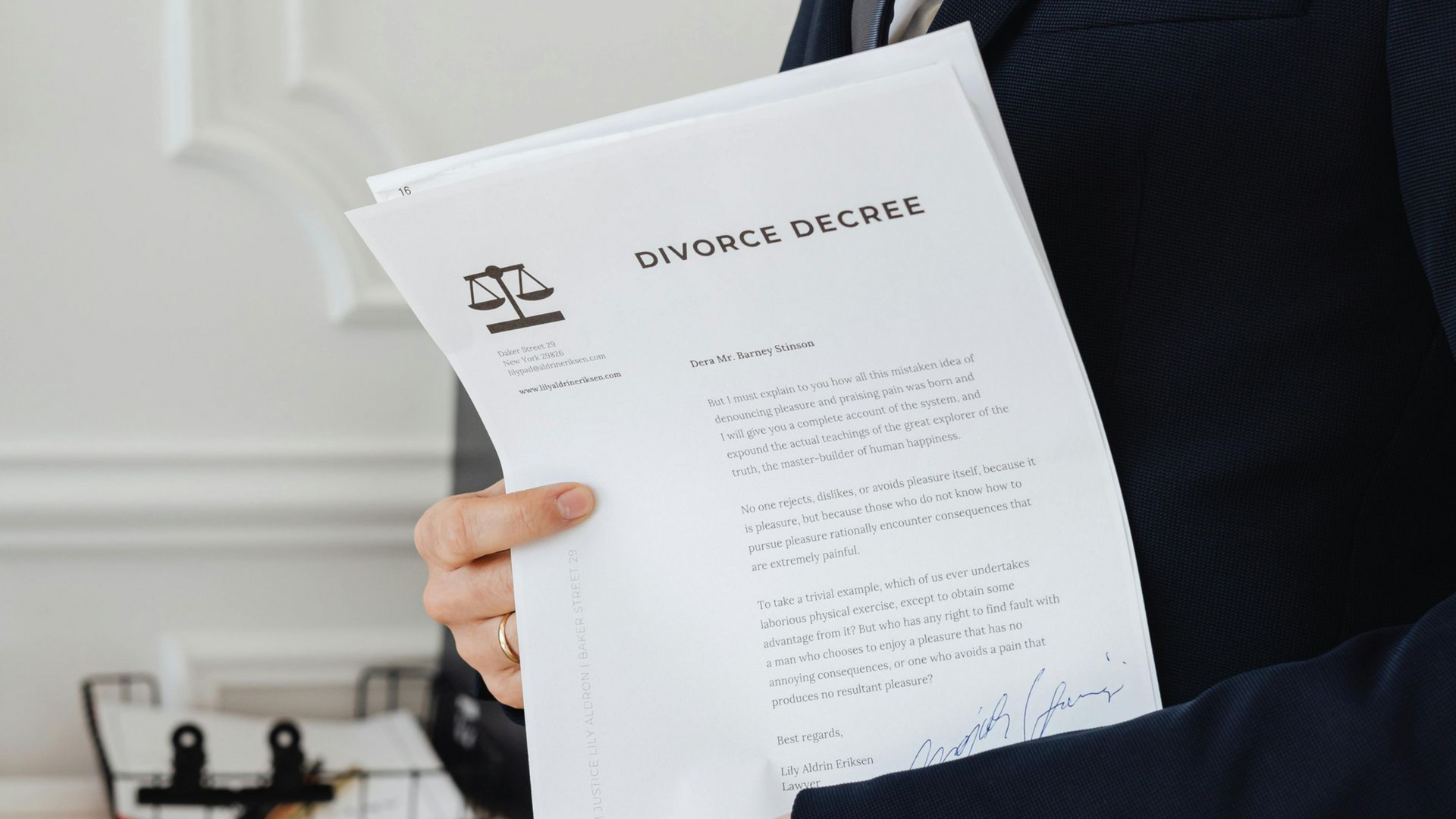 Person in a suit holding a 