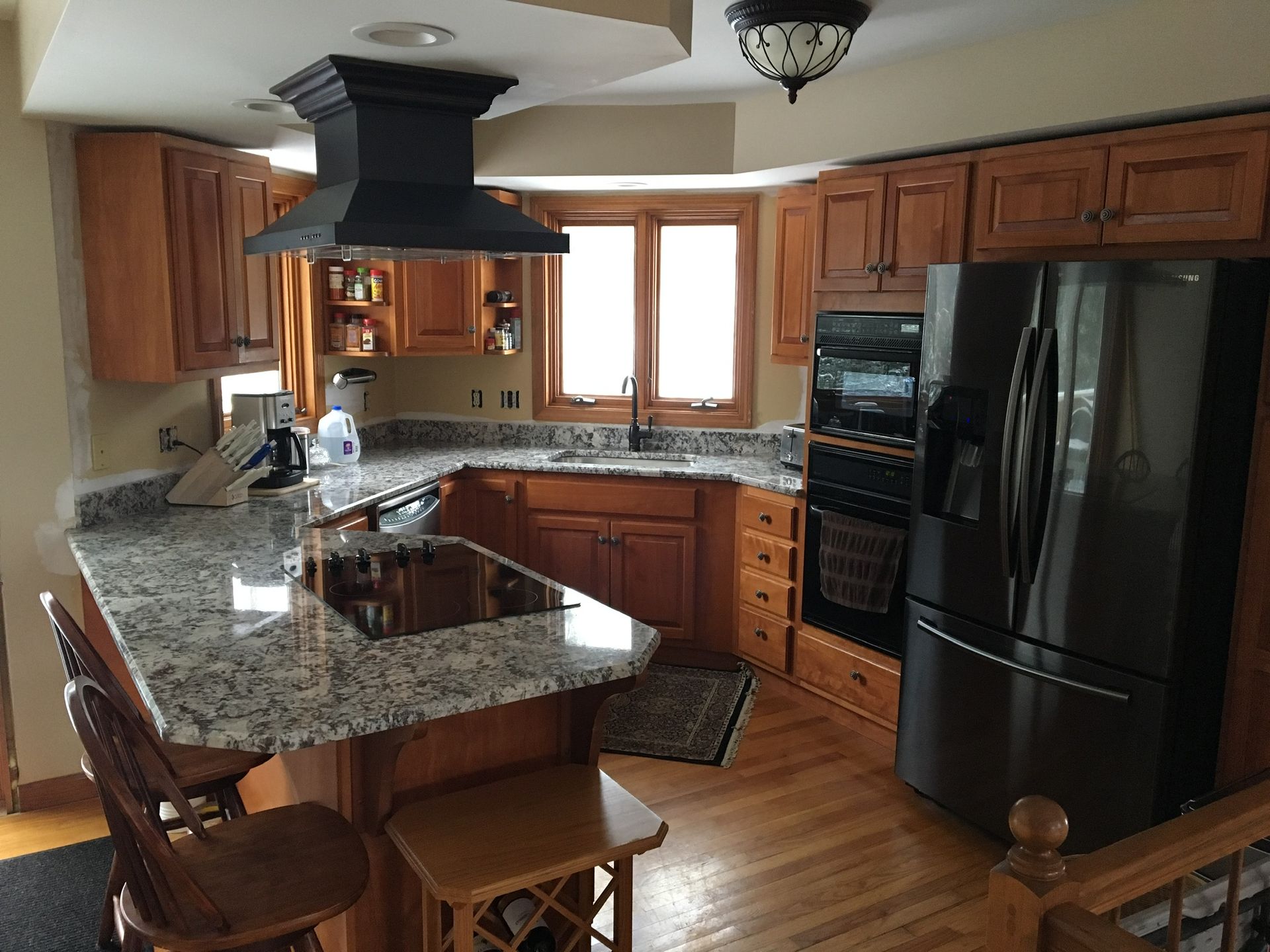 A kitchen with stainless steel appliances and granite counter tops