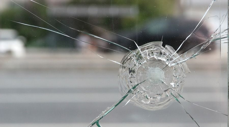 Cracked Window With a Circular Impact Point — Local Glassmaster in Huskisson, NSW