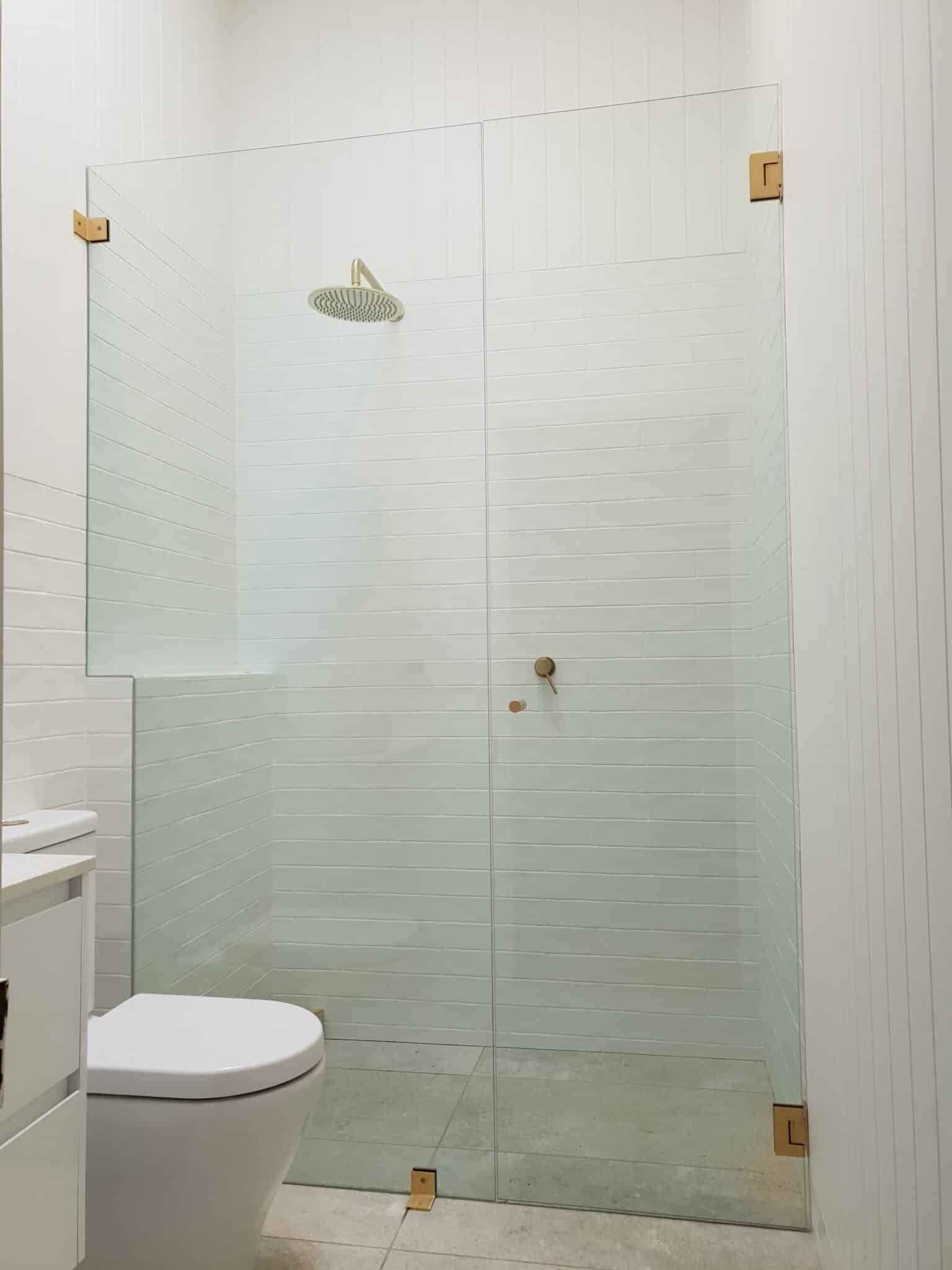 Bright White Bathroom with Glass Shower — Local Glassmaster in Huskisson, NSW