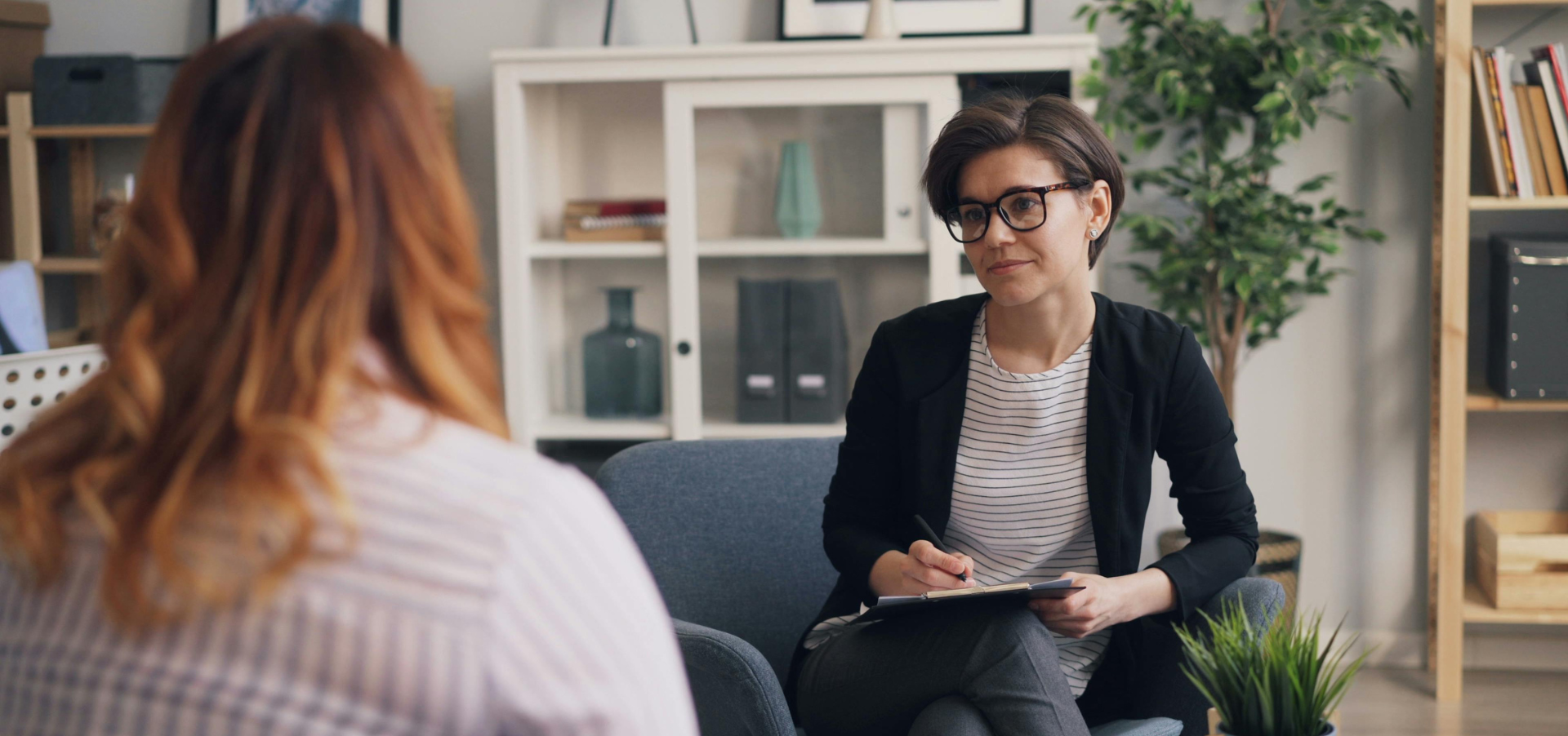 A therapist speaks with a patient.